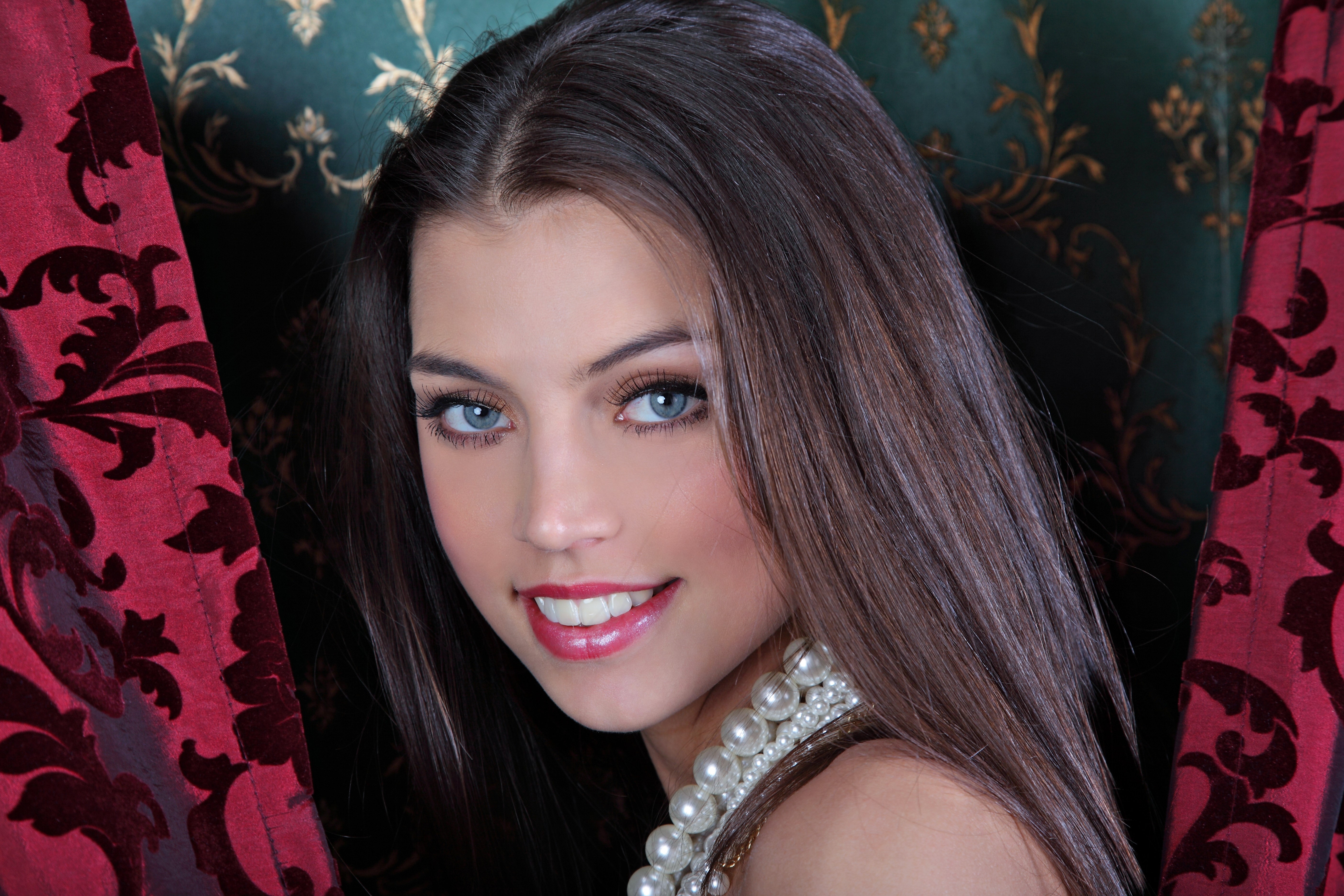 Beautiful young woman with brown hair and blue eyes HD Wallpaper