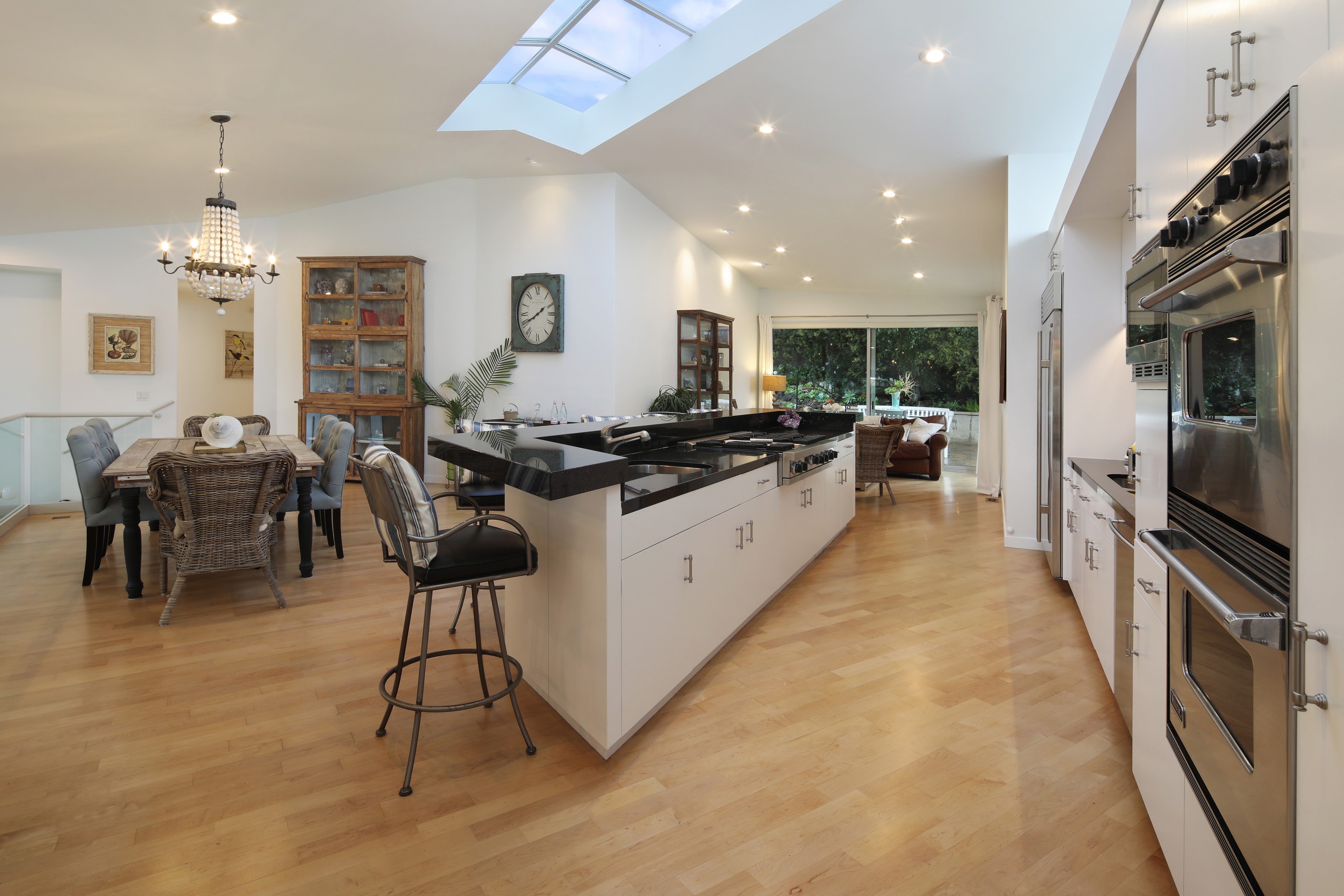 Modern Kitchen and Dining Area with Skylight HD Wallpaper