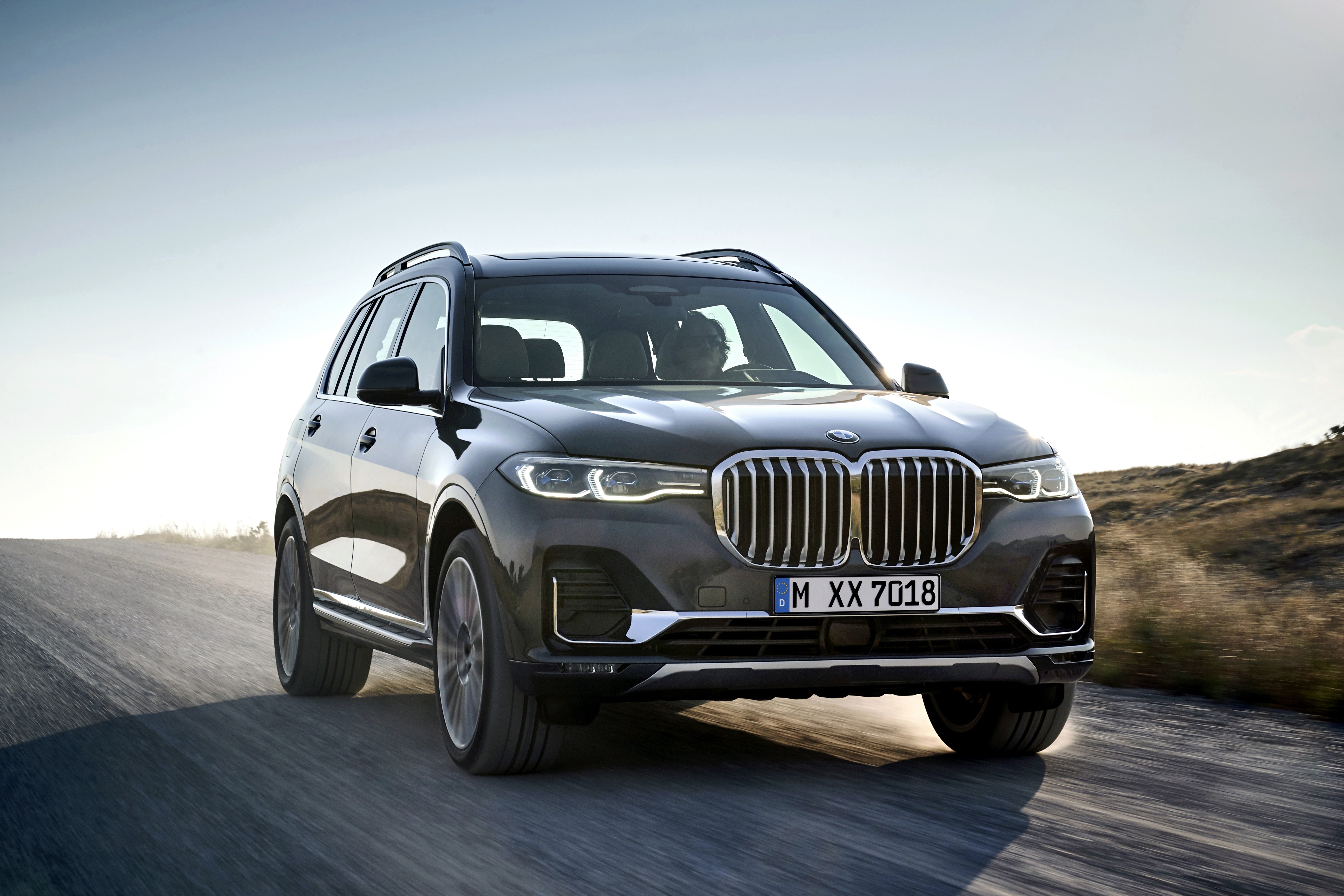Grey Metallic BMW X7 G07 Driving on Road HD Wallpaper