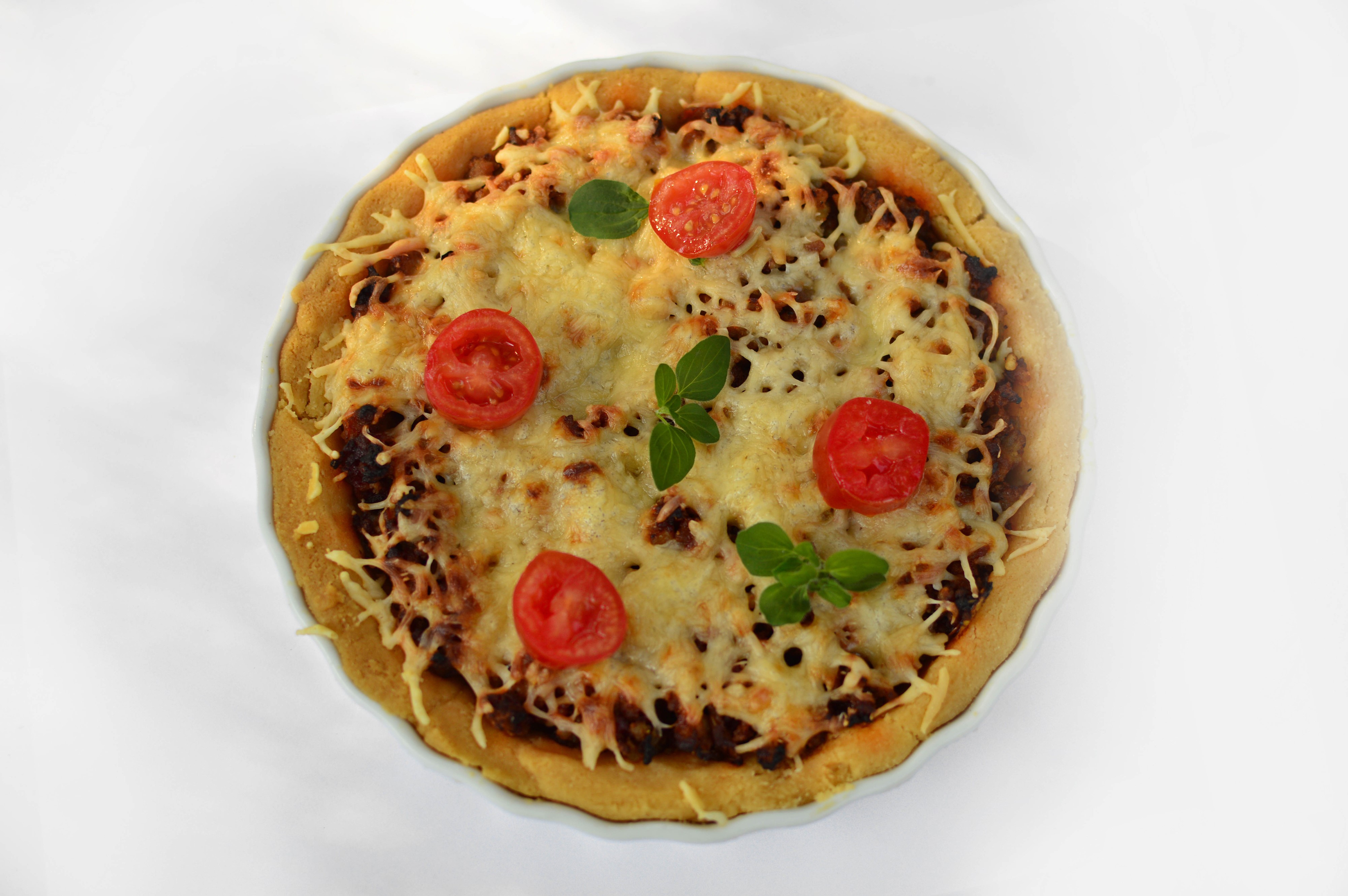 Pizza with tomatoes and cheese on white background HD Wallpaper
