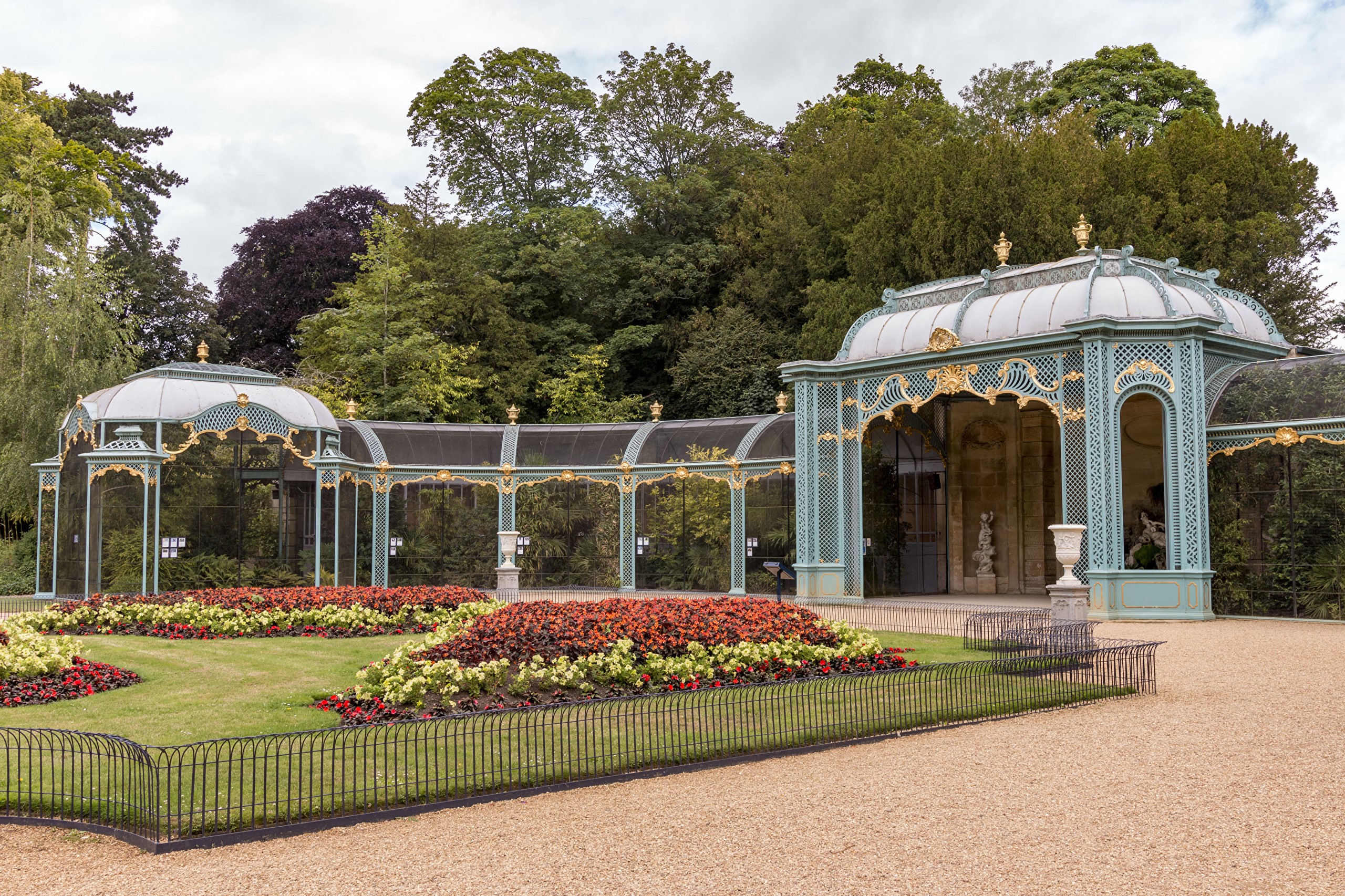 Waddesdon Manor gardens with ornate aviary and flower beds HD Wallpaper