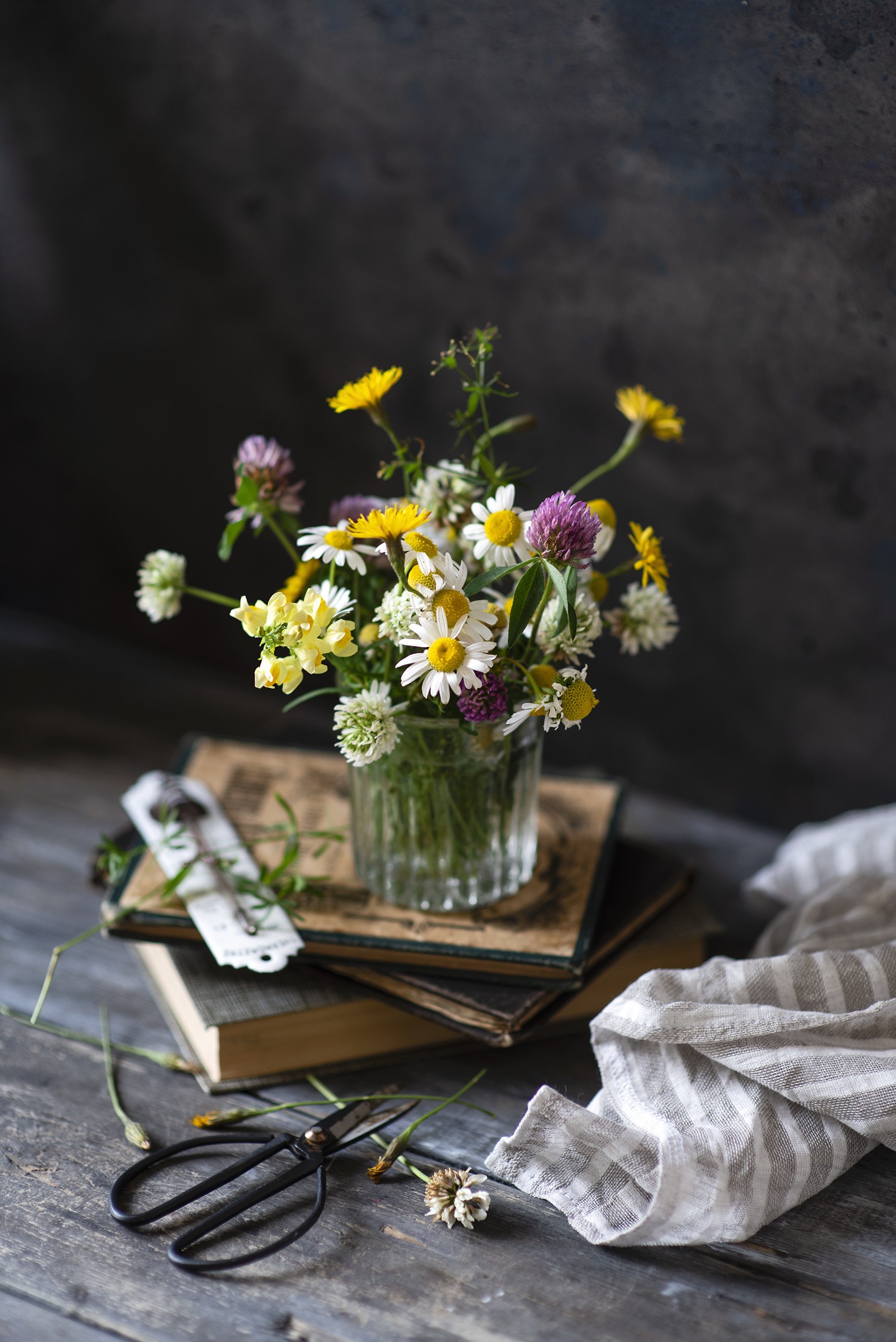 Wildflowers in a vase on books with scissors HD Phone Wallpaper