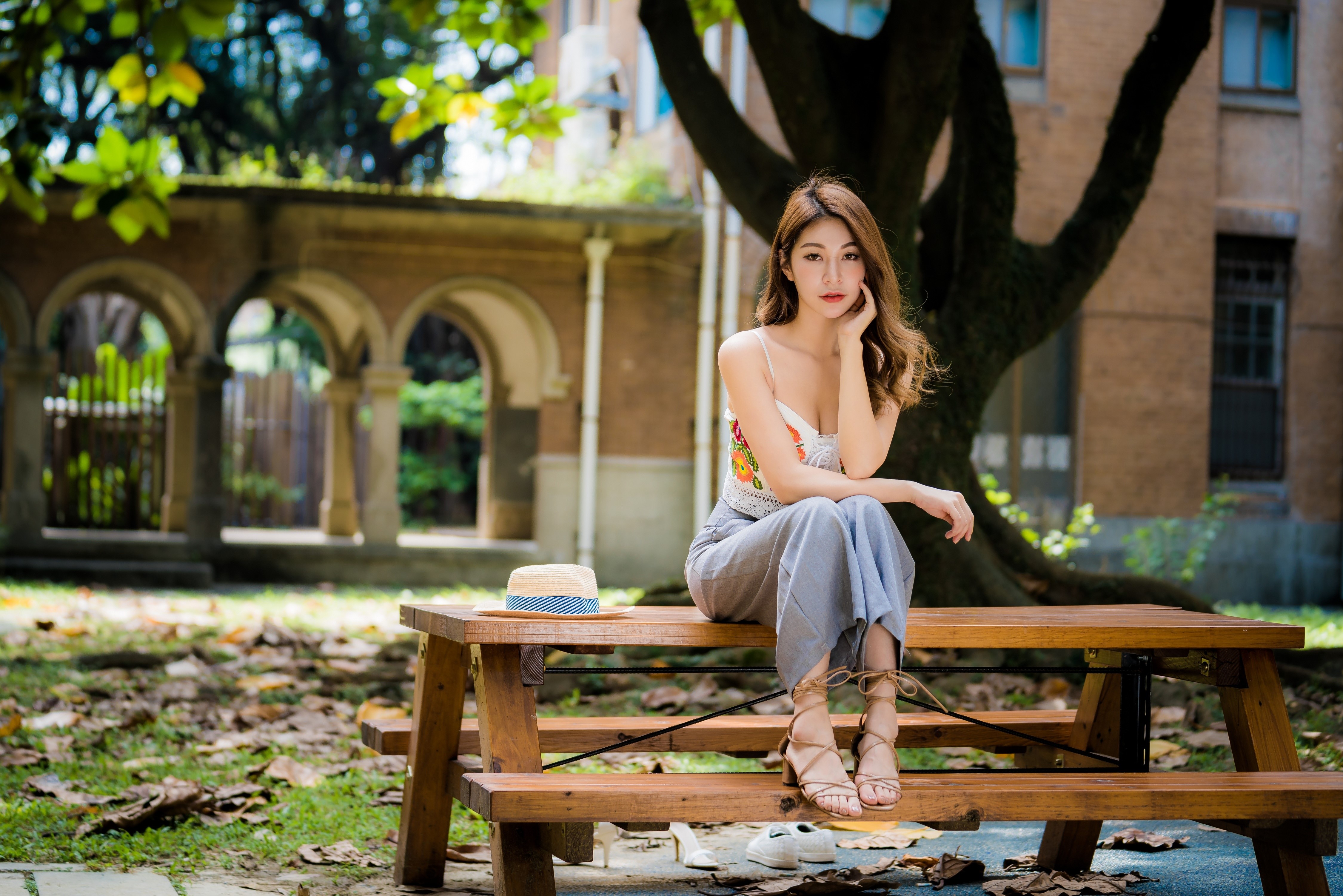 4K Outdoor Portrait of Woman Sitting on Bench HD Wallpaper