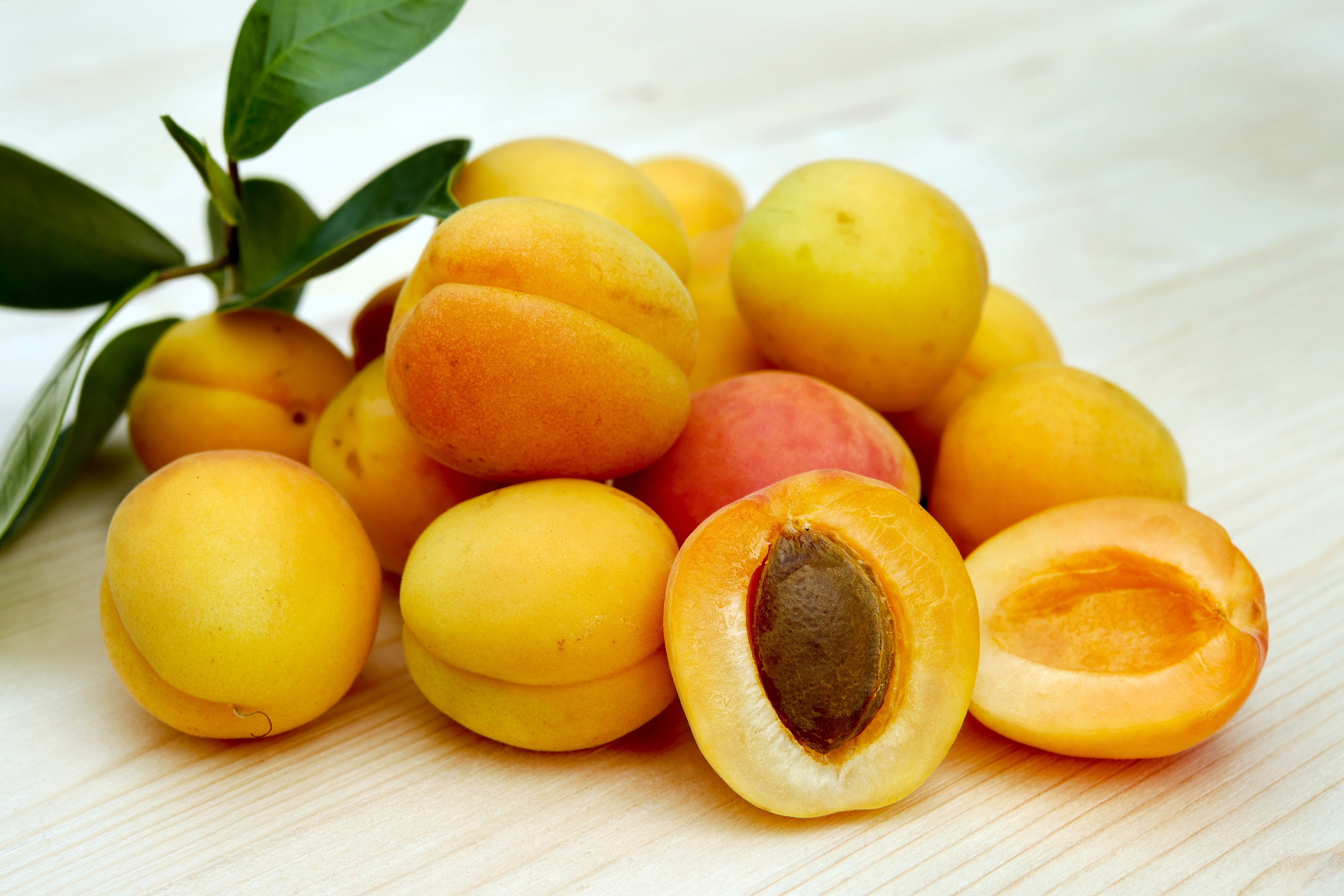 Many Apricots on a Wooden Surface HD Wallpaper