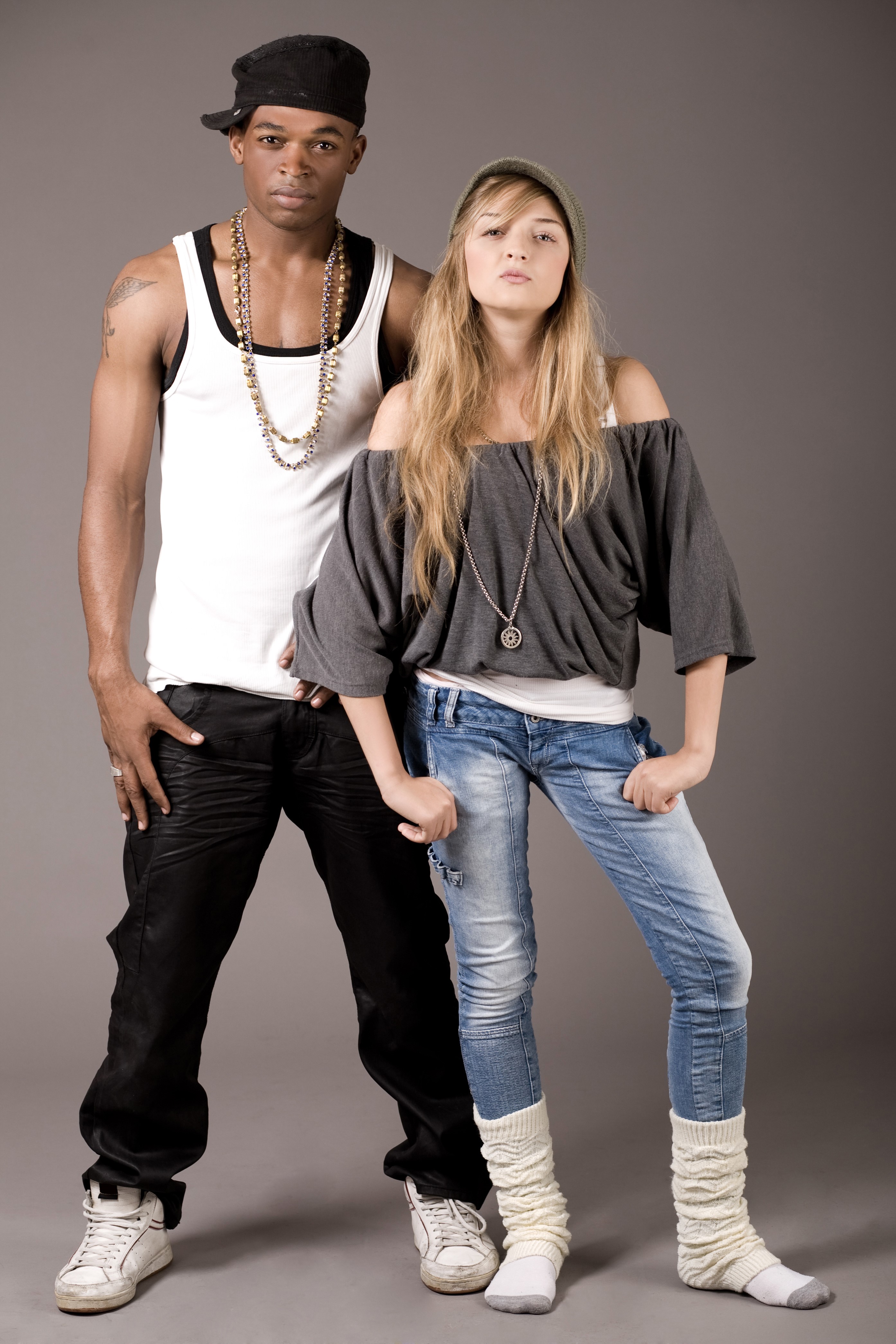 Man and woman in casual hip-hop attire HD Phone Wallpaper
