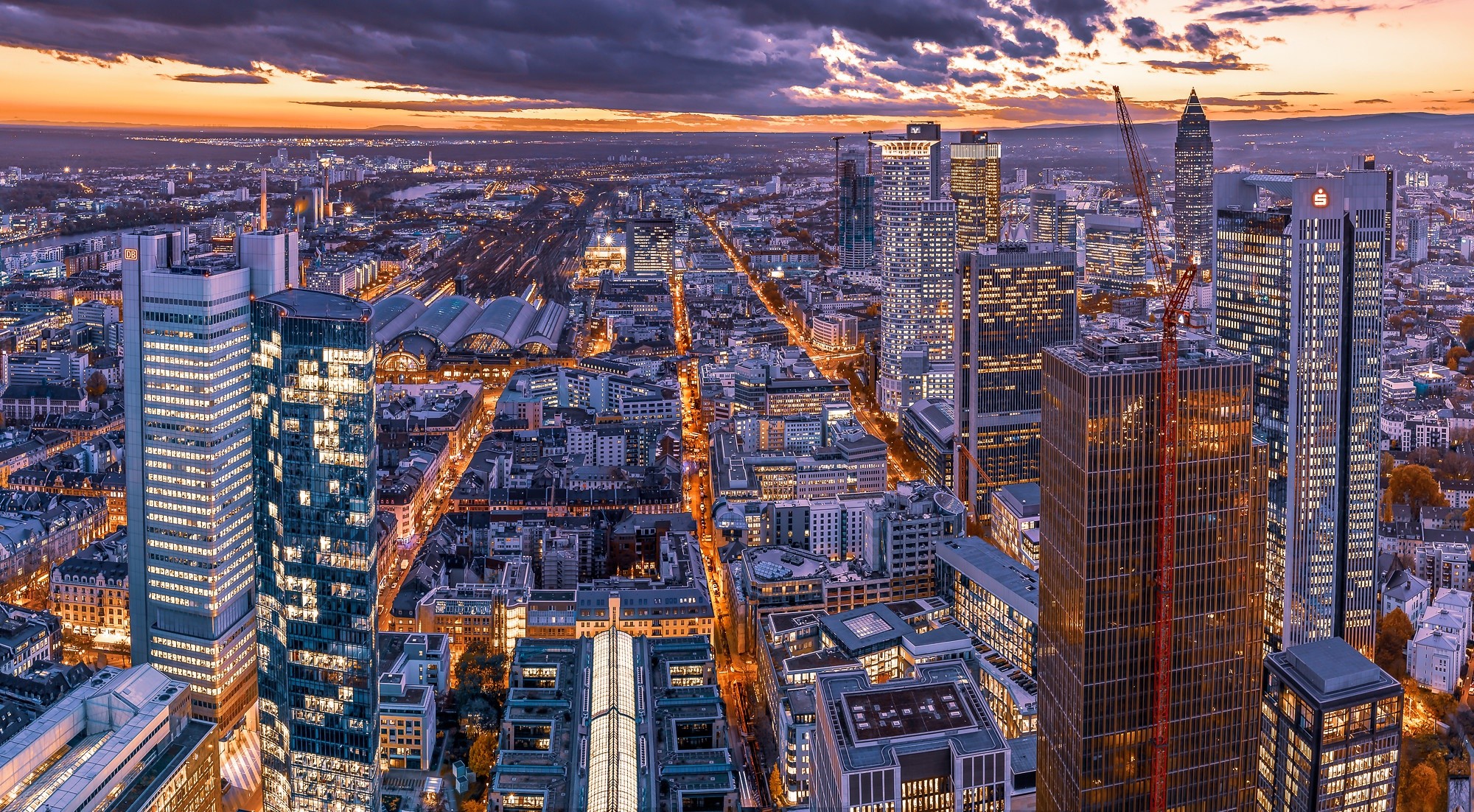 Frankfurt skyline at dusk with skyscrapers and train station HD Wallpaper
