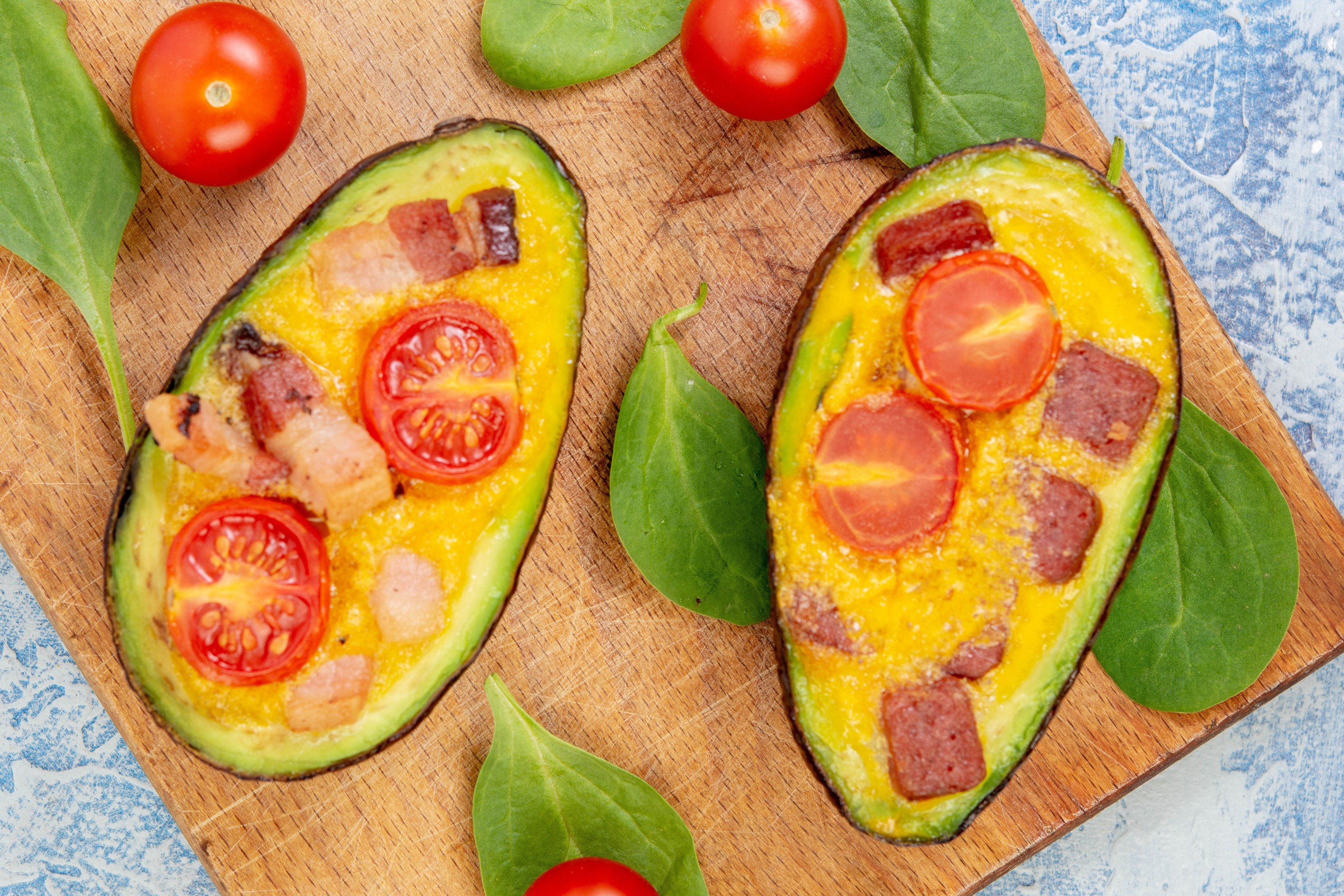 Baked Avocados with Tomatoes and Bacon on Cutting Board HD Wallpaper