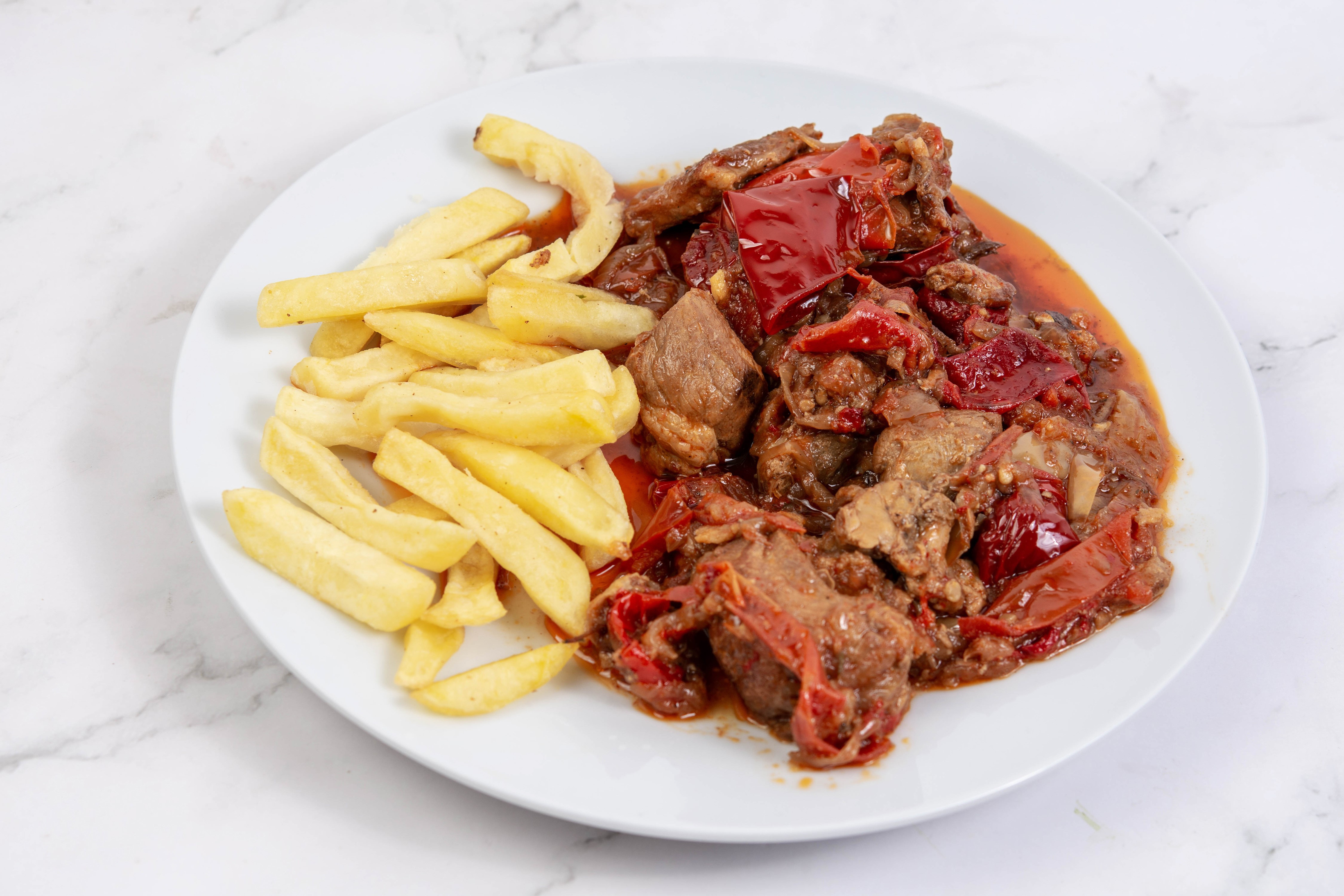 Meat with peppers and french fries on a plate HD Wallpaper