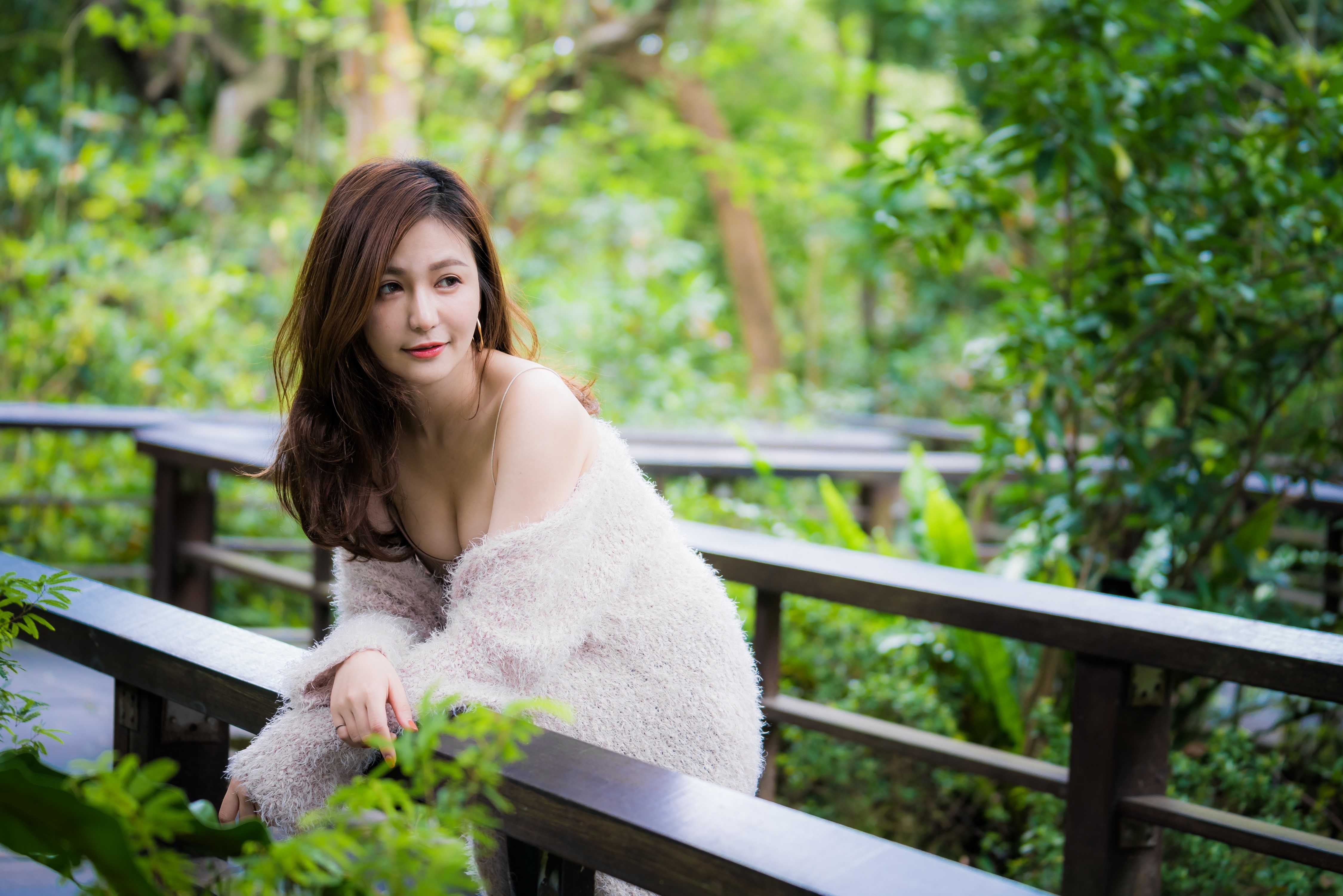 Asian woman with brown hair posing on a wooden walkway HD Wallpaper