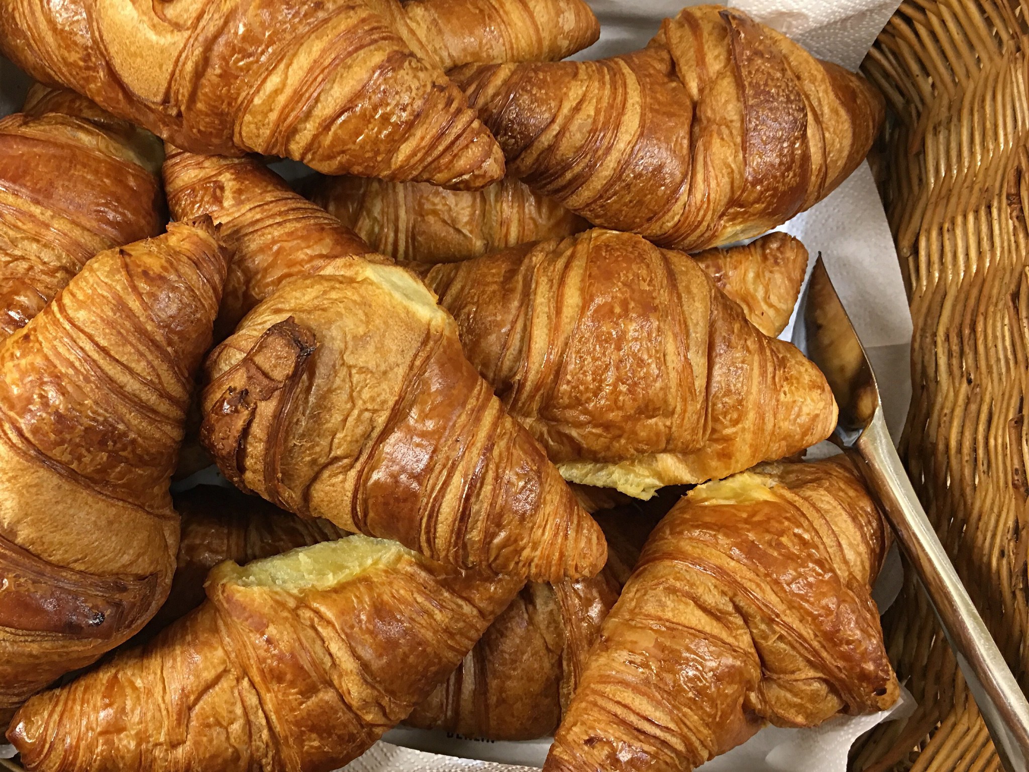 Golden brown croissants in a basket HD Wallpaper