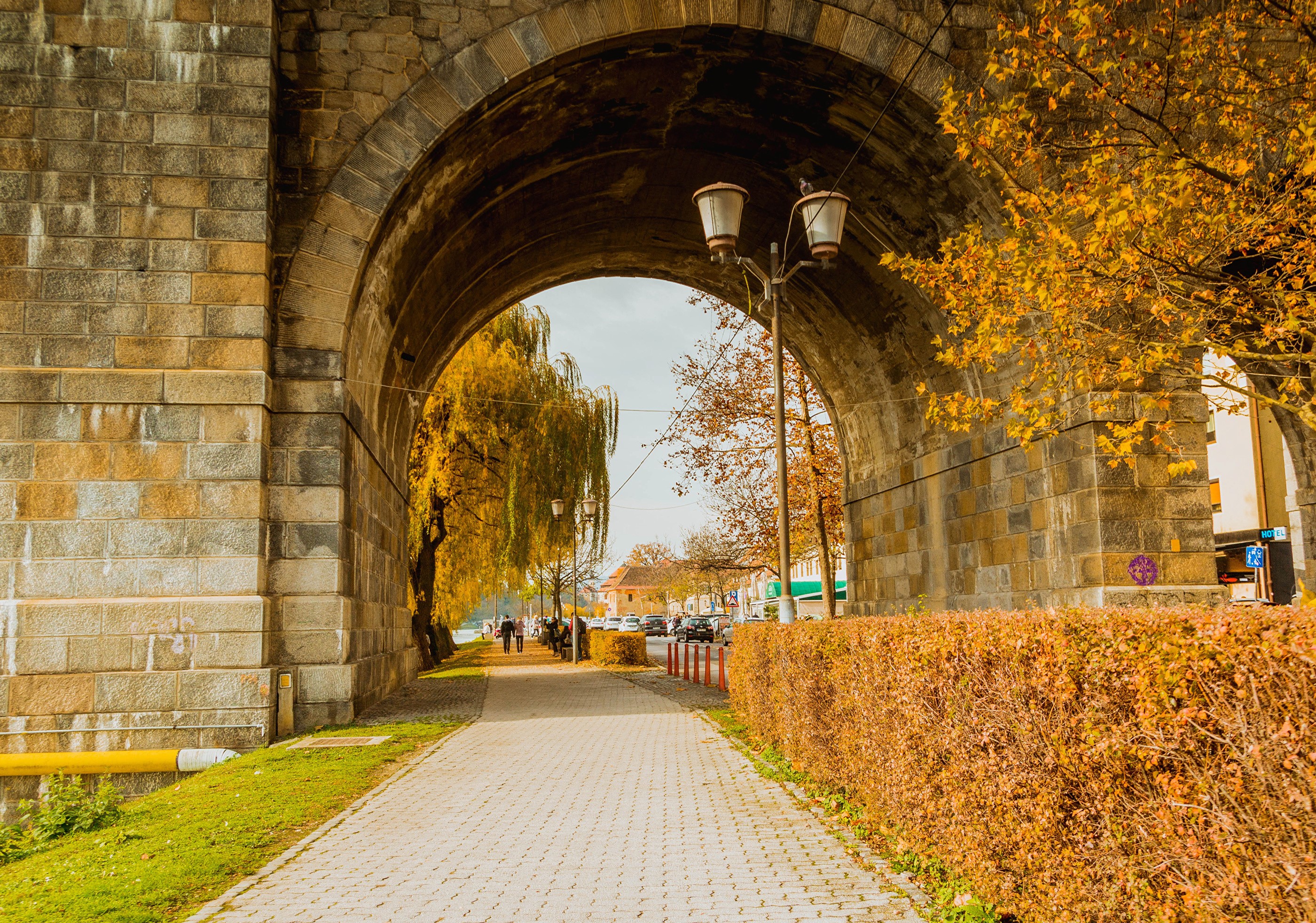 Archway in Maribor, Slovenia with autumn trees HD Wallpaper
