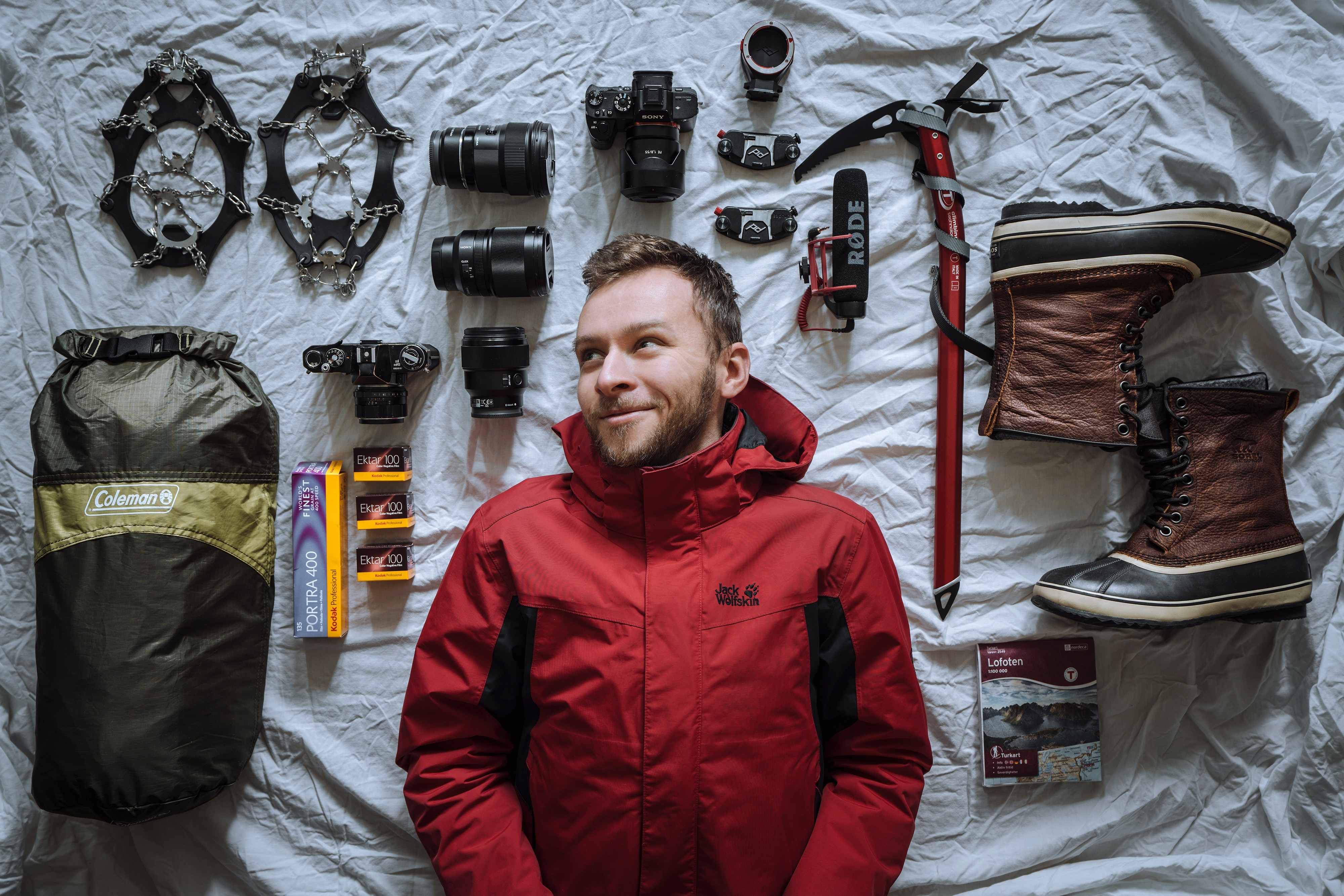 Man with climbing and photography gear HD Wallpaper