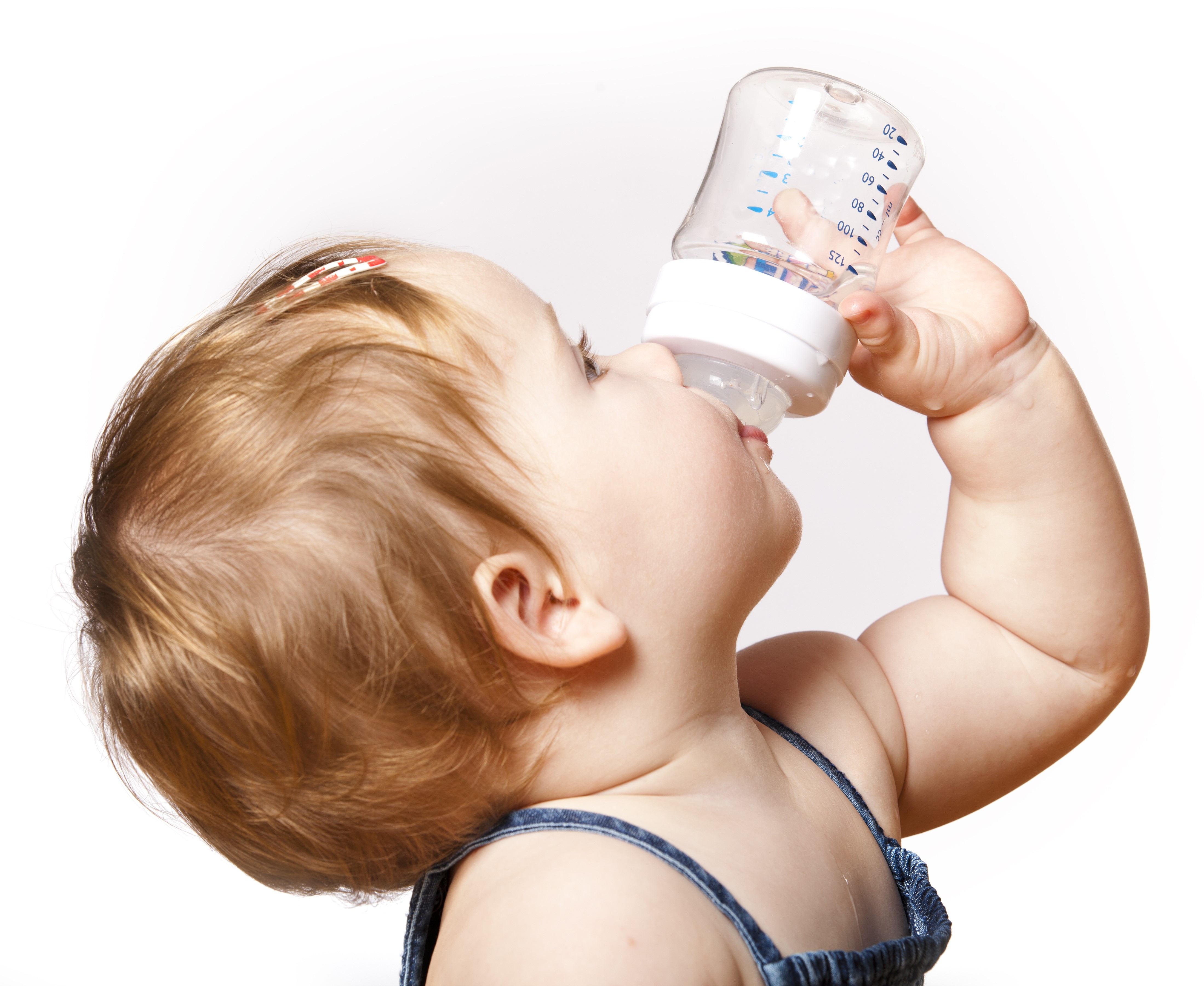 Baby drinking from a bottle HD Wallpaper