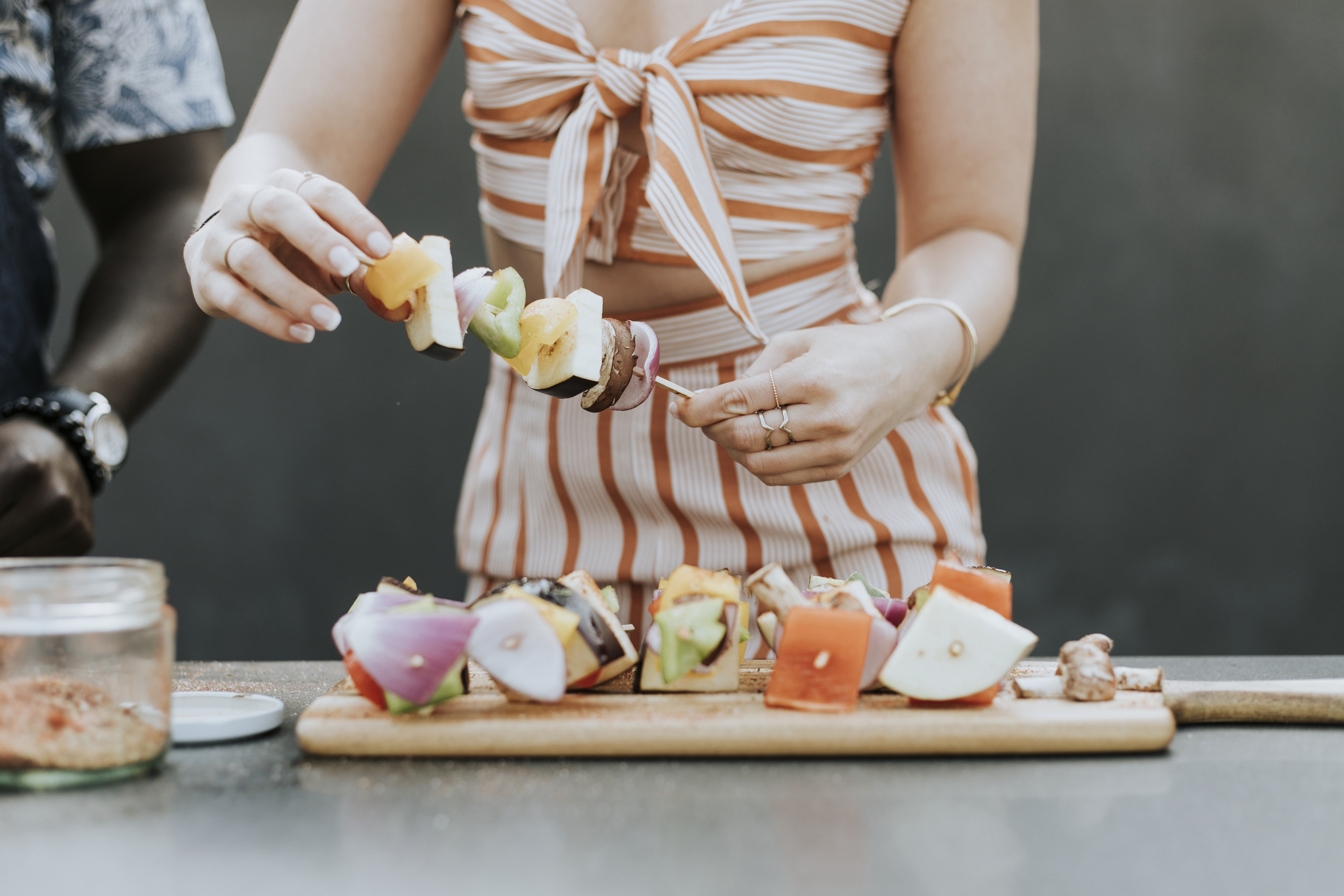Woman preparing shashlik on cutting board HD Wallpaper