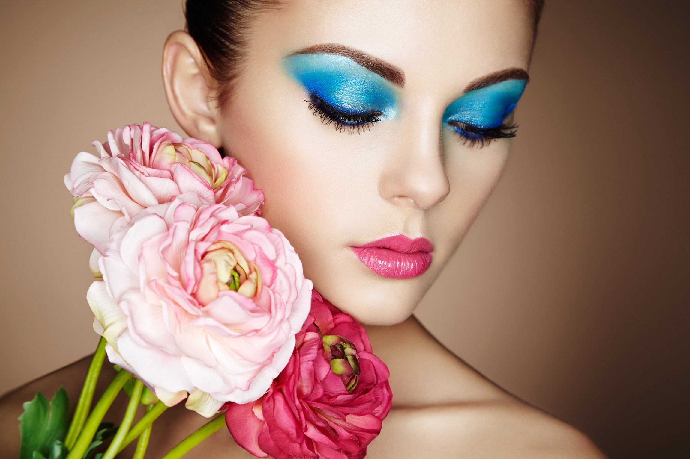 Woman with blue eyeshadow and pink flowers HD Wallpaper