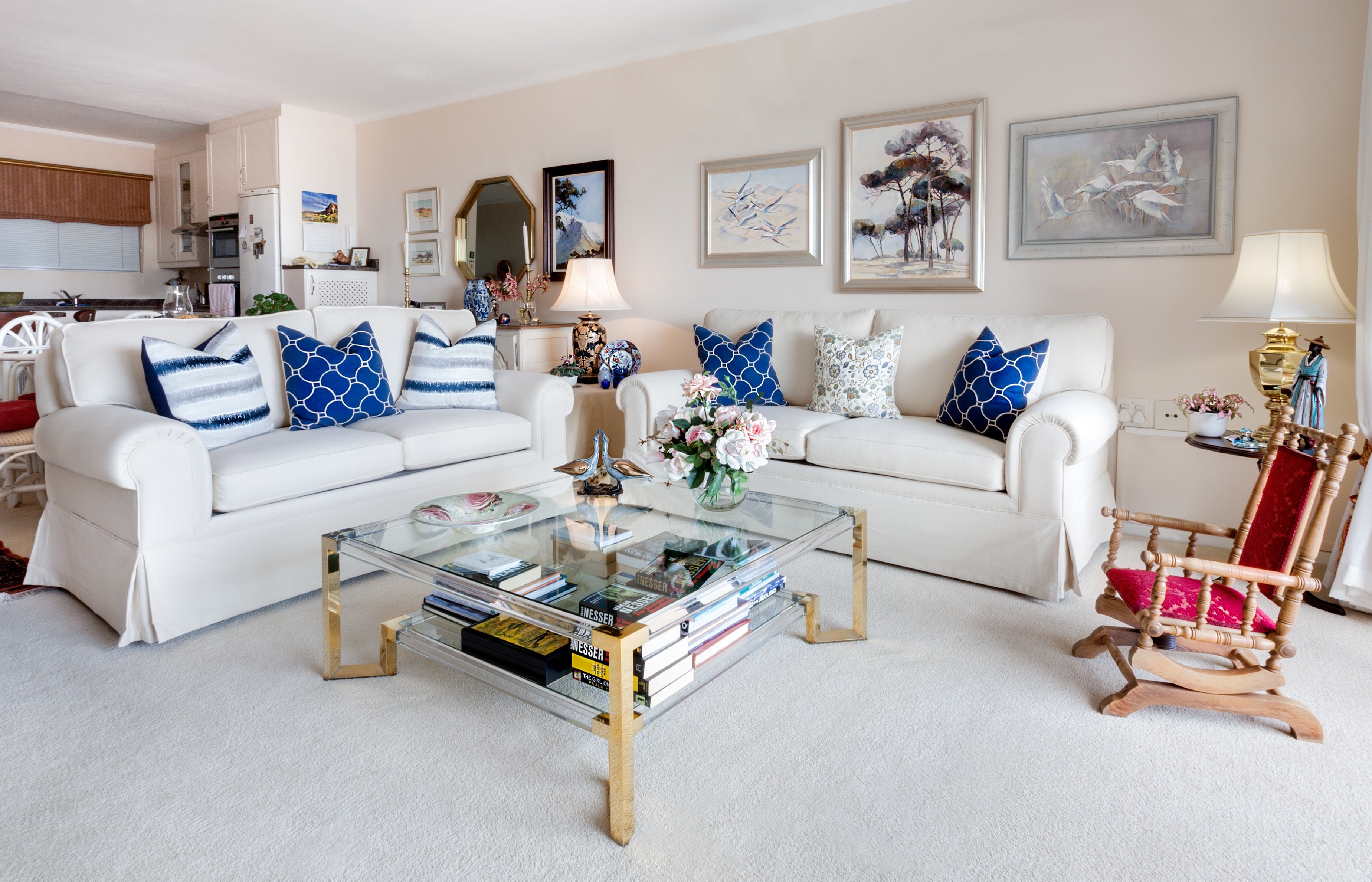 Living room with sofas, coffee table, and rocking chair HD Wallpaper