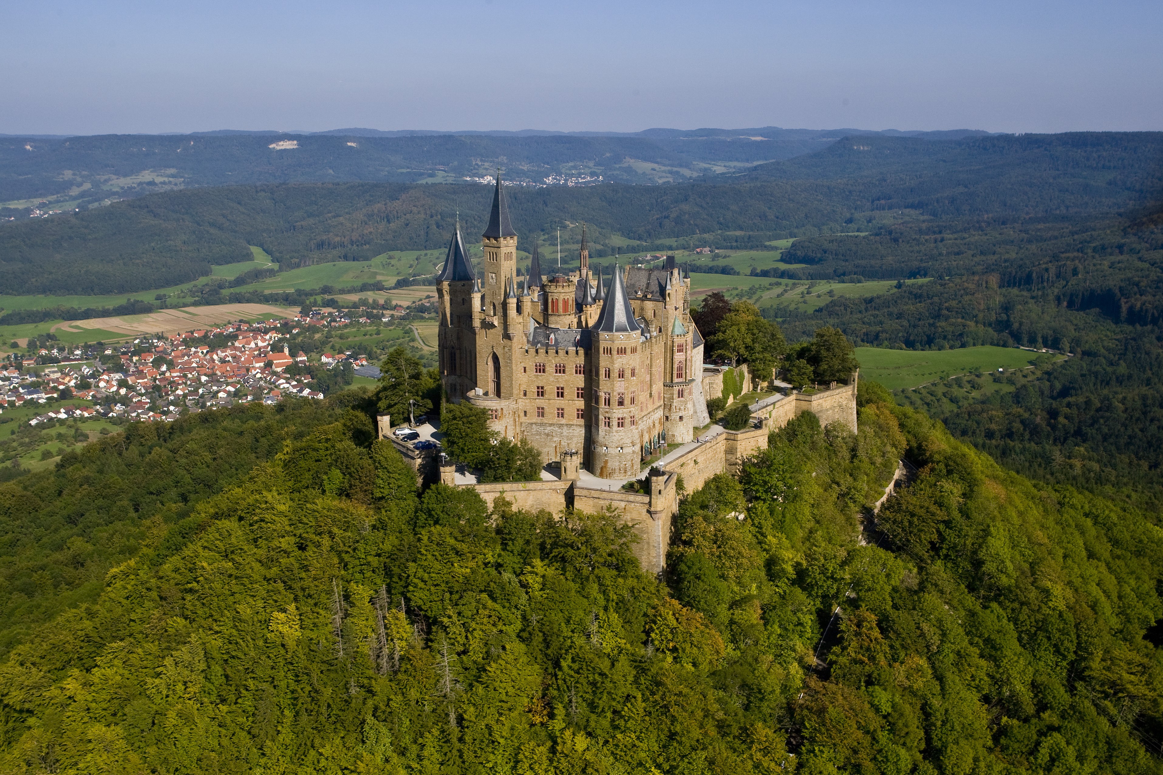Hohenzollern Castle on a forested hill in Germany HD Wallpaper
