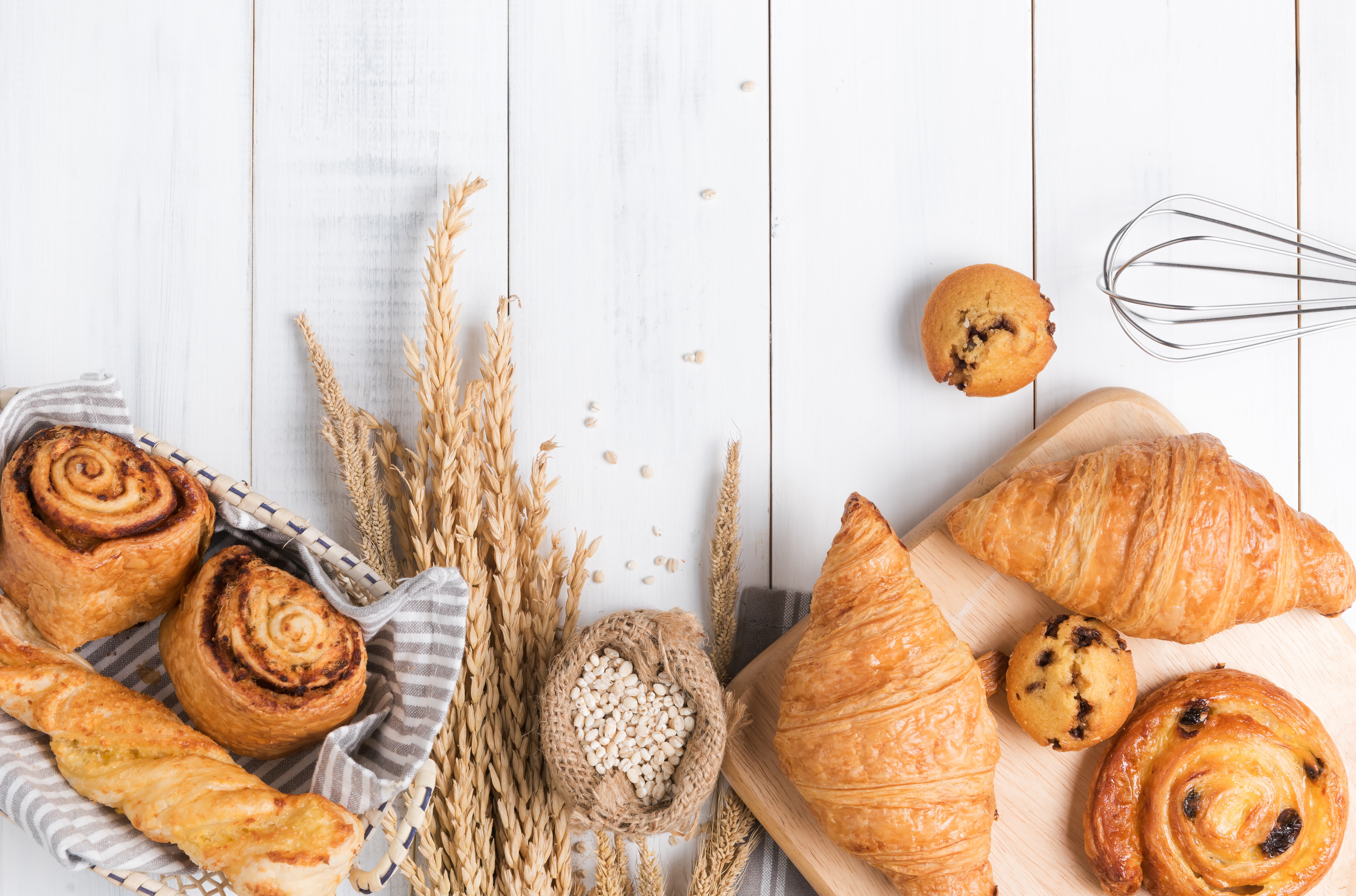 Assortment of Baked Goods and Wheat Stalks HD Wallpaper