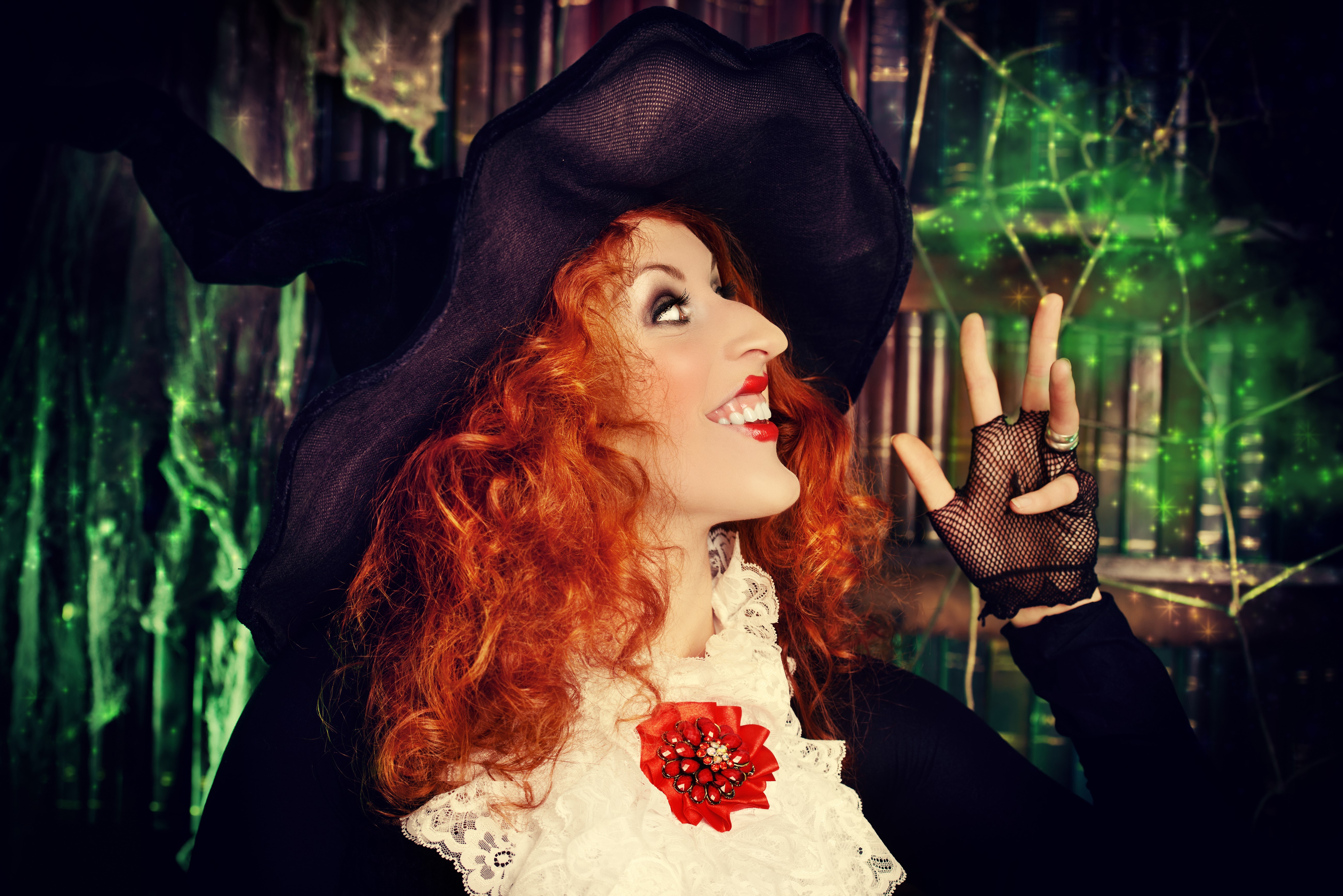Witch with red hair and a hat casting a spell HD Wallpaper