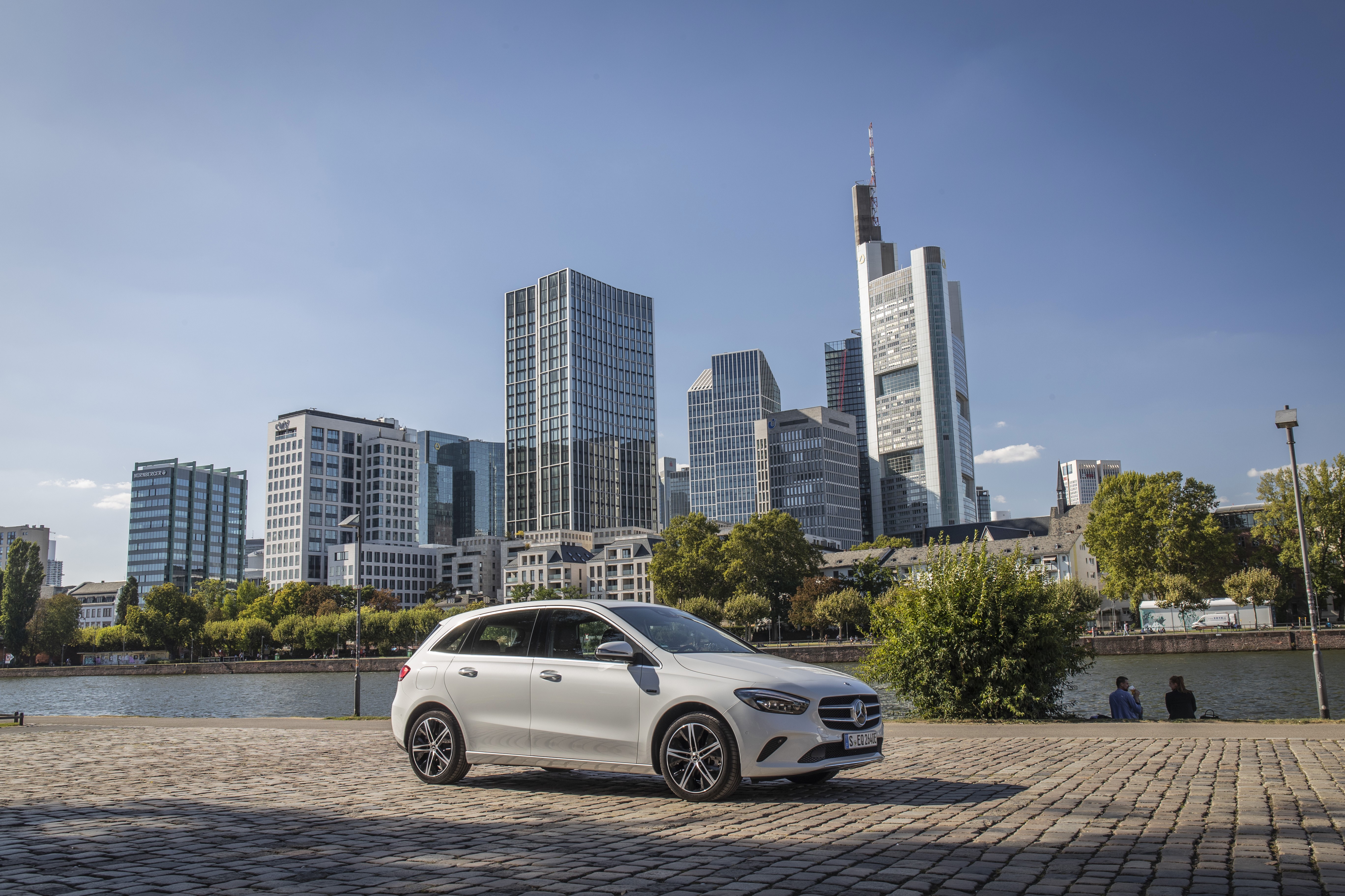 White 2019 Mercedes-Benz B 250 e Hybrid vehicle in city HD Wallpaper