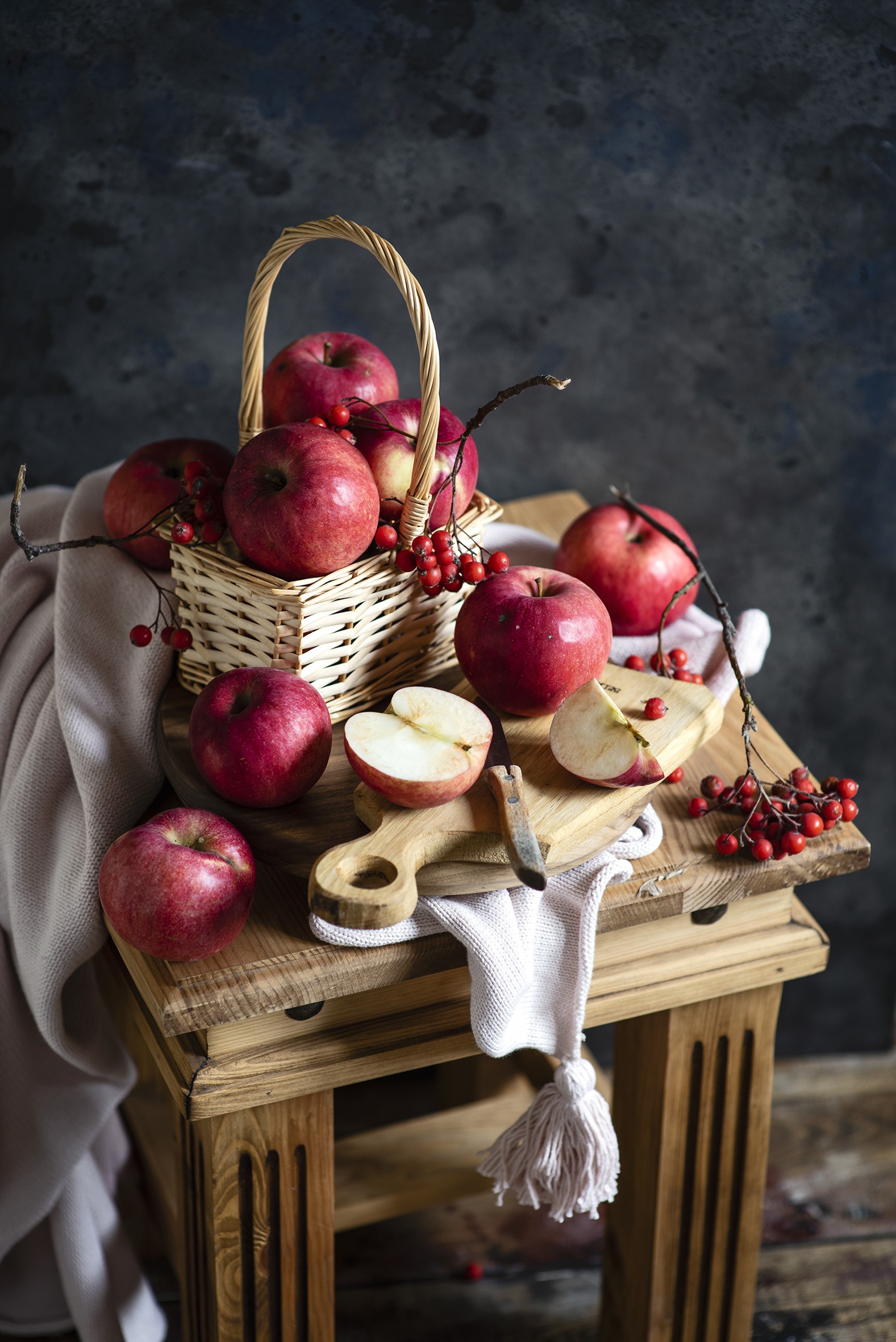 Apples and Sorbus berries in a basket on a wooden stool HD Phone Wallpaper