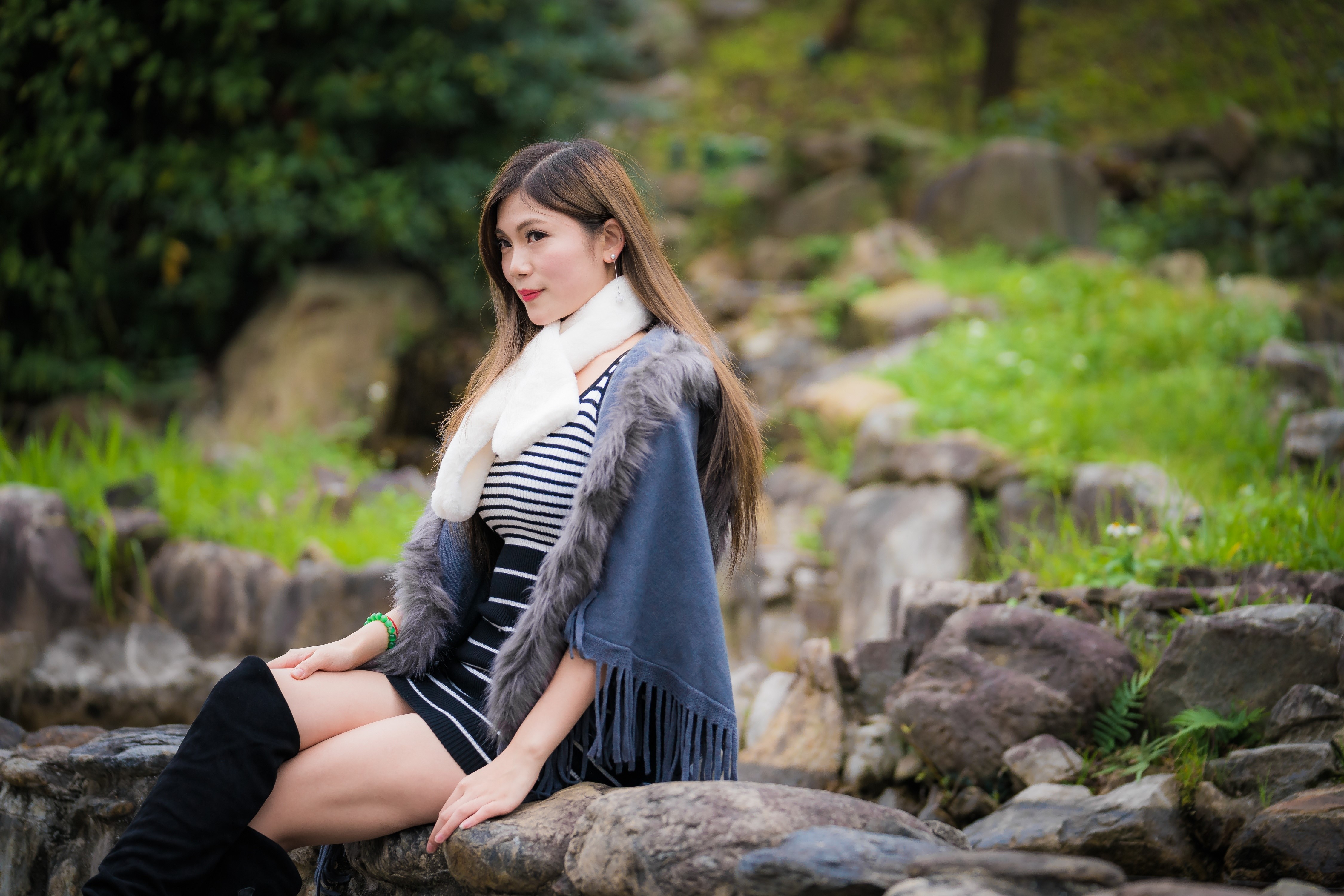 Asian woman sitting on stones with scarf HD Wallpaper
