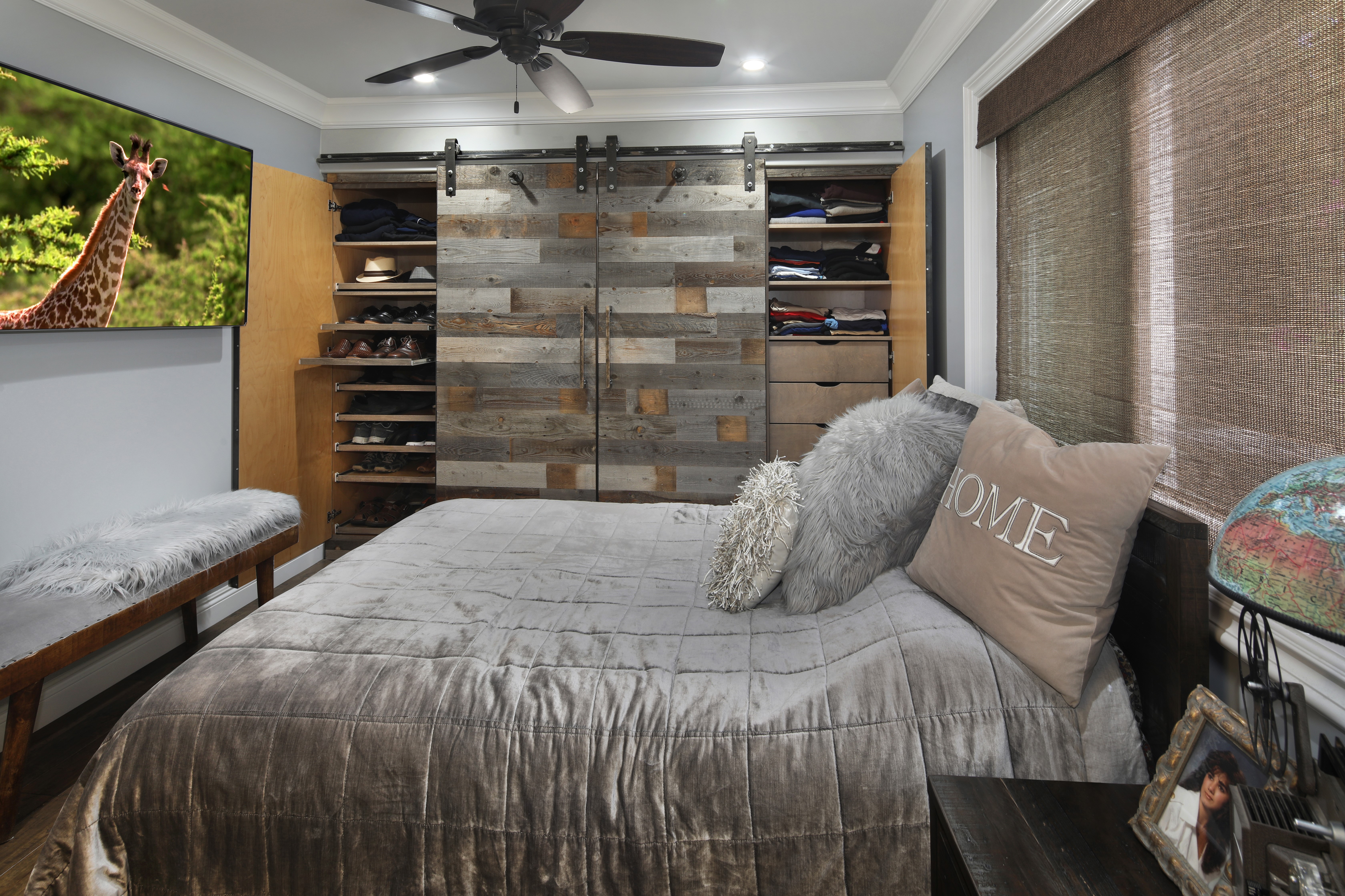 Bedroom with sliding barn doors and TV HD Wallpaper