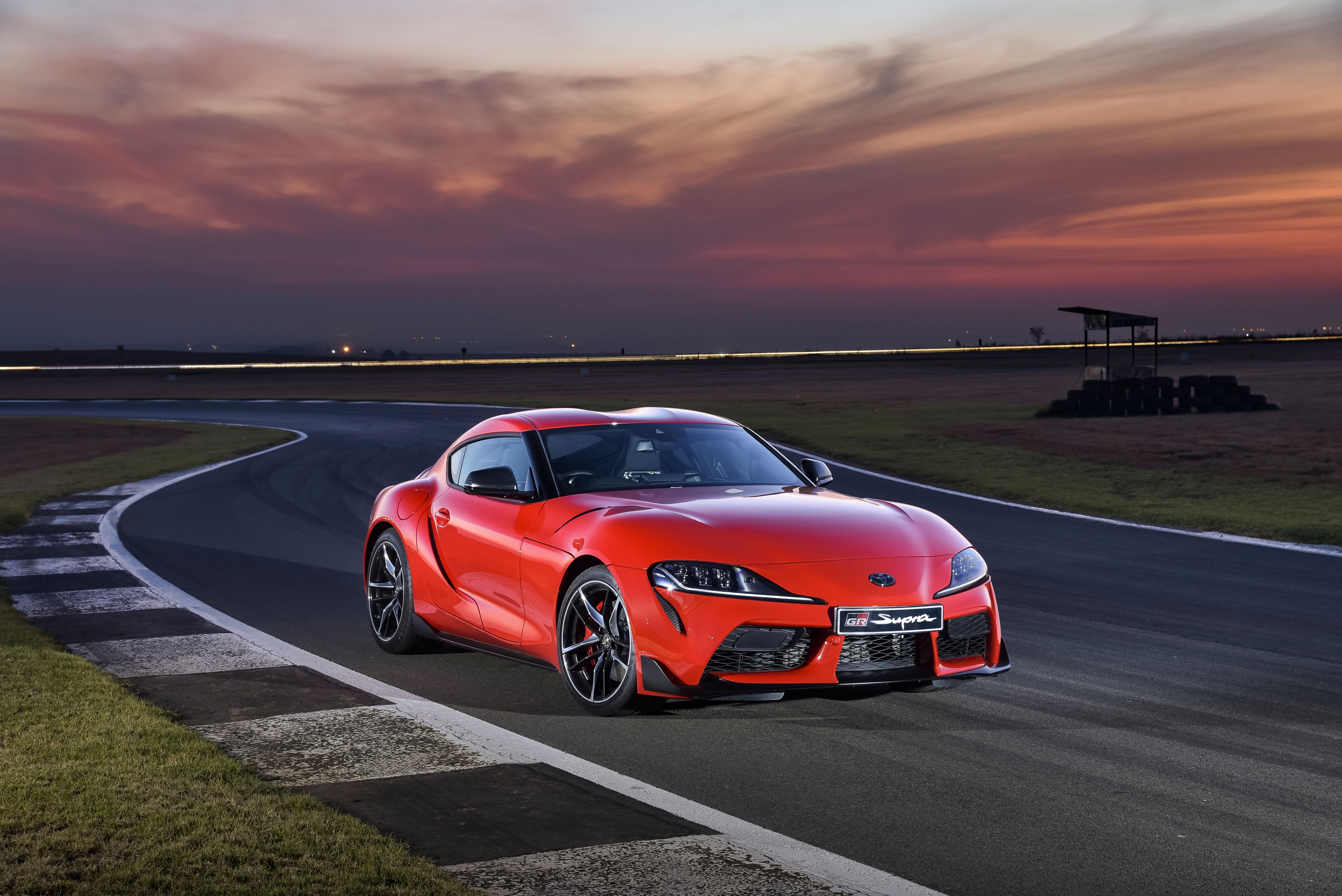 Red 2019 GR Supra on a Racetrack HD Wallpaper