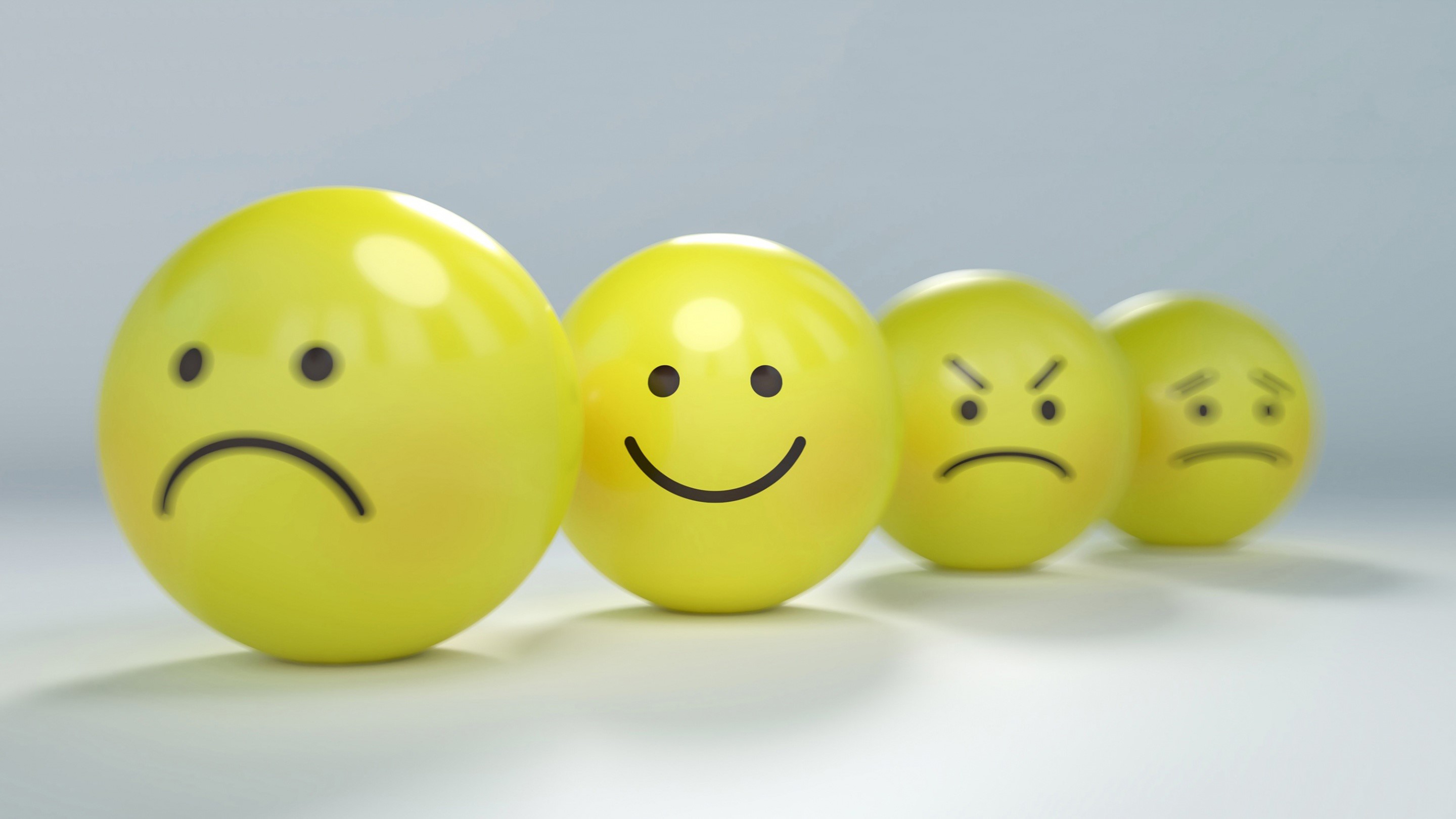 Four smiley faces with different emotions HD Wallpaper