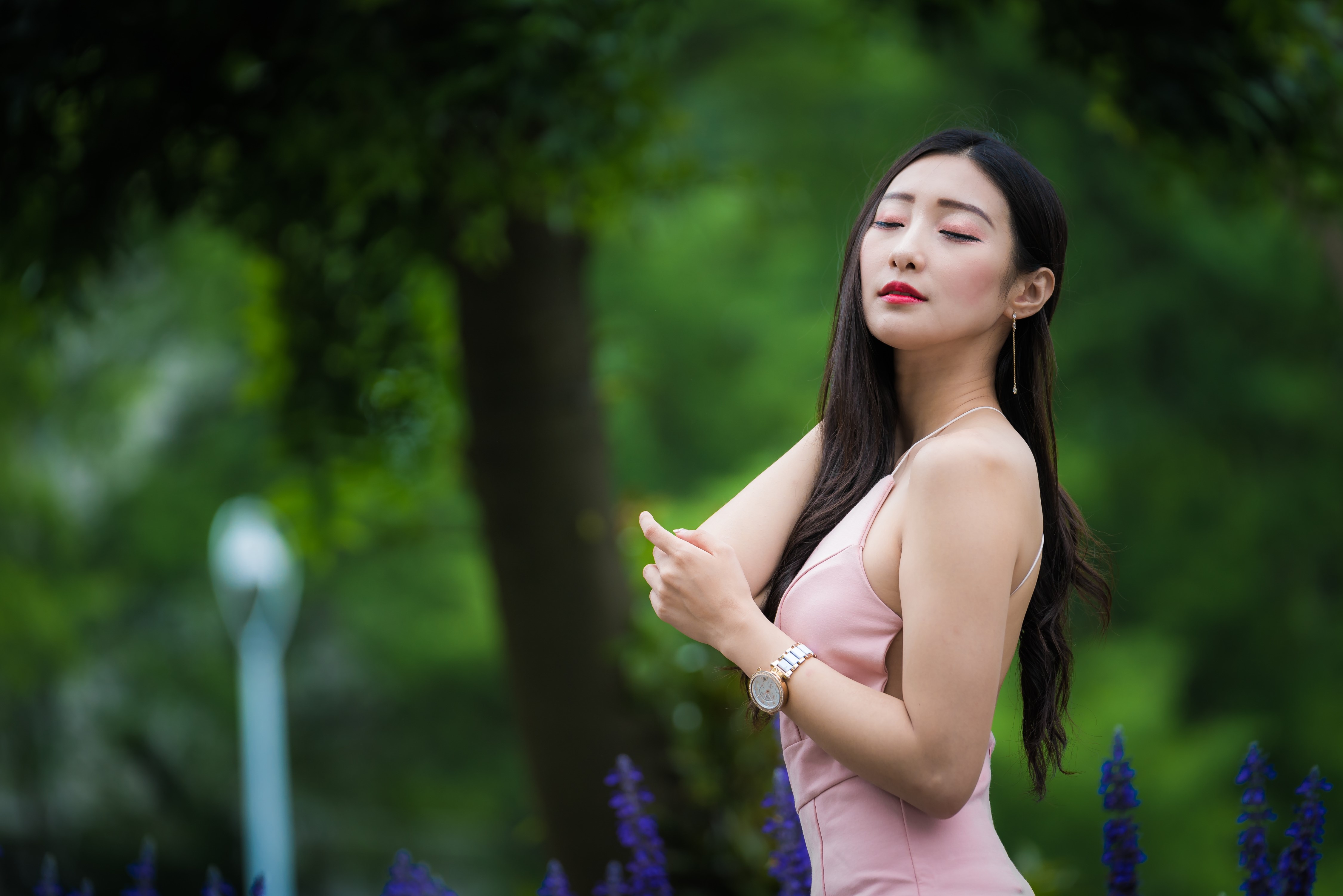 Asian woman in pink dress posing outdoors HD Wallpaper