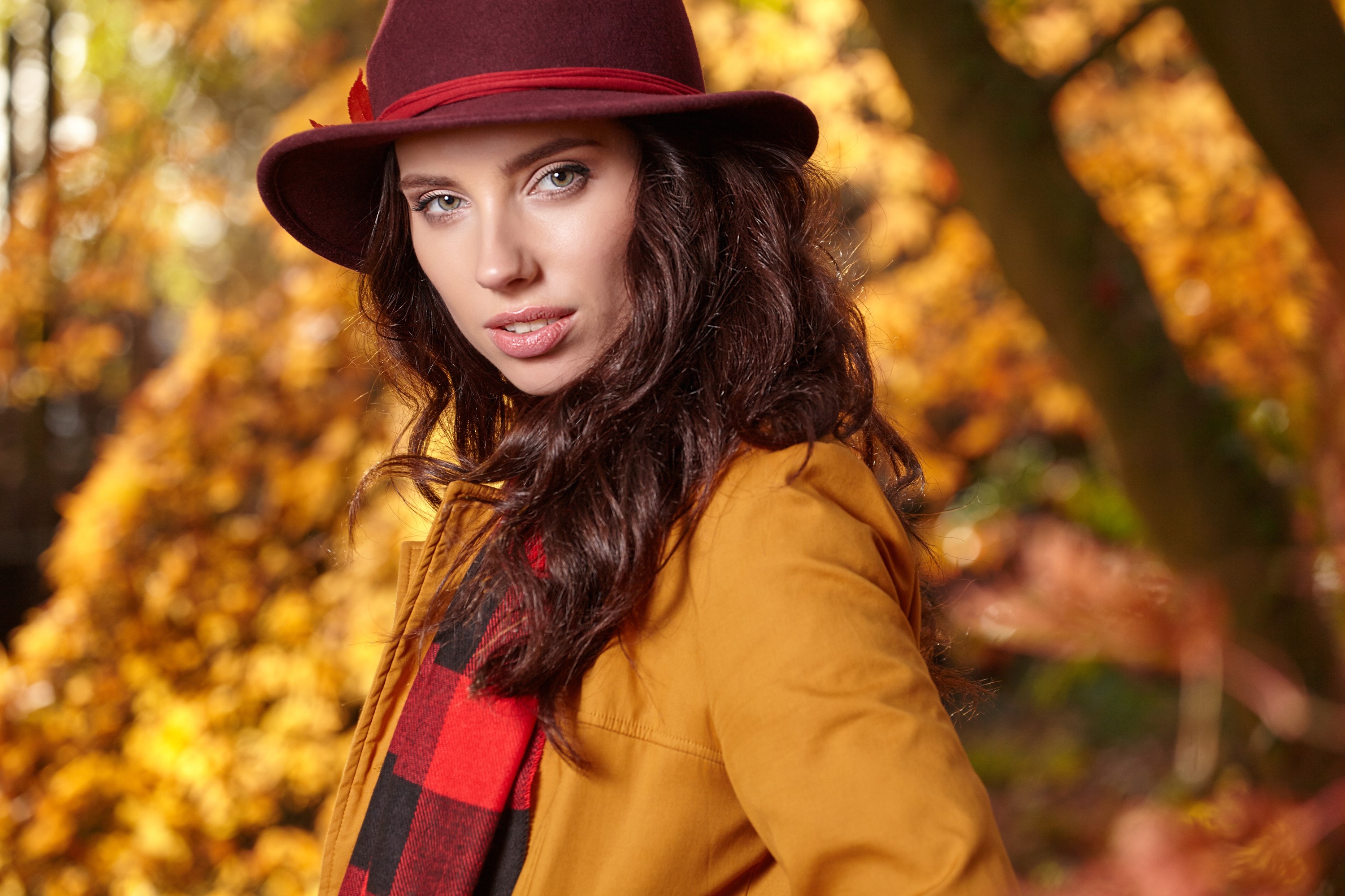 Woman in hat and coat in autumn forest HD Wallpaper