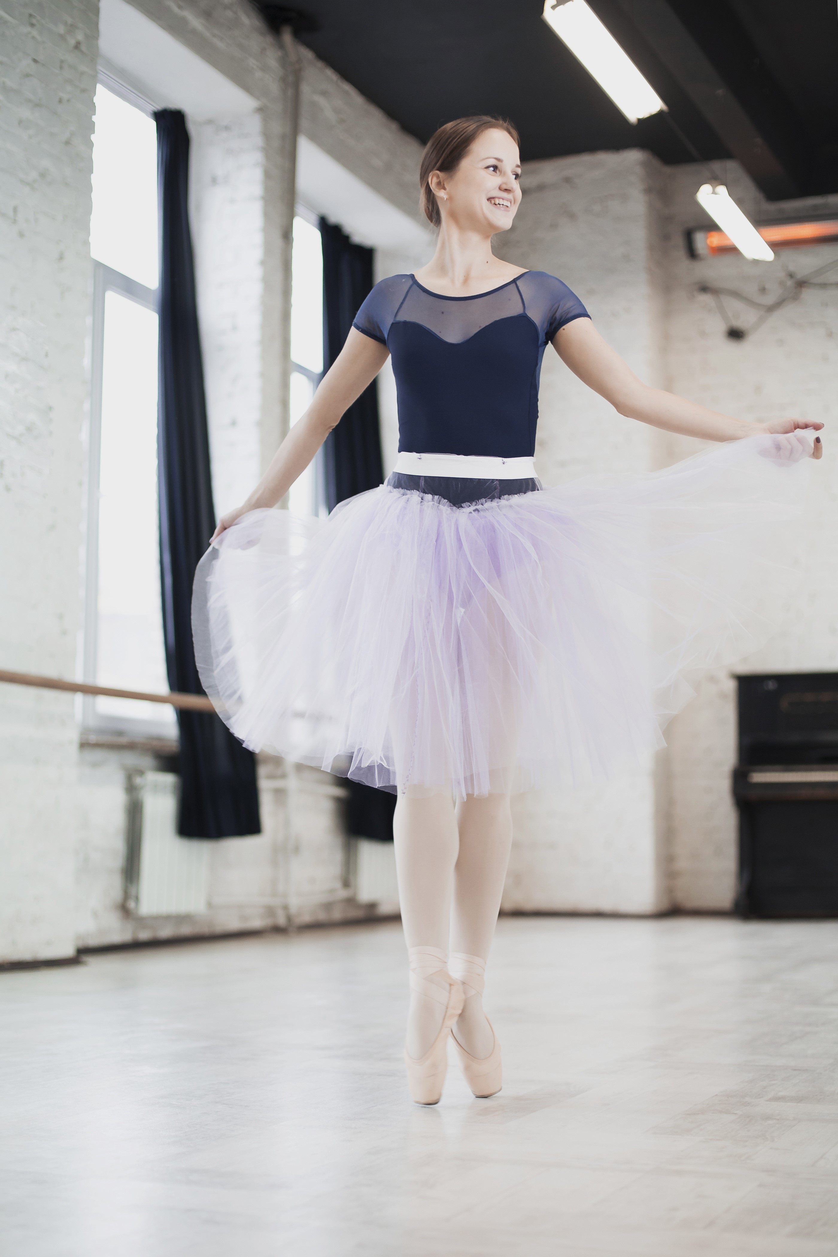 Ballerina in a tutu dancing in a studio HD Phone Wallpaper