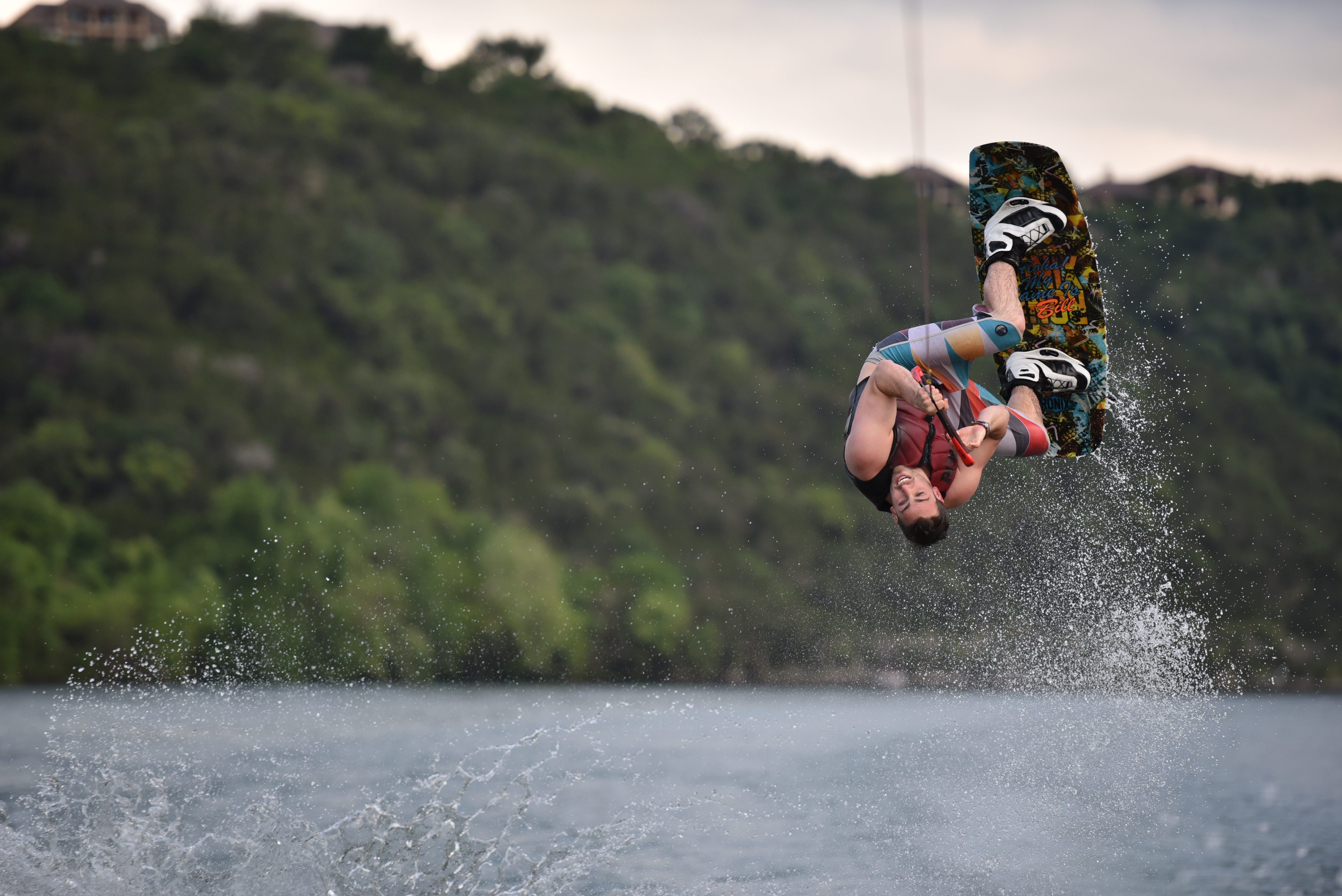 Man wakeboarding and jumping over water HD Wallpaper