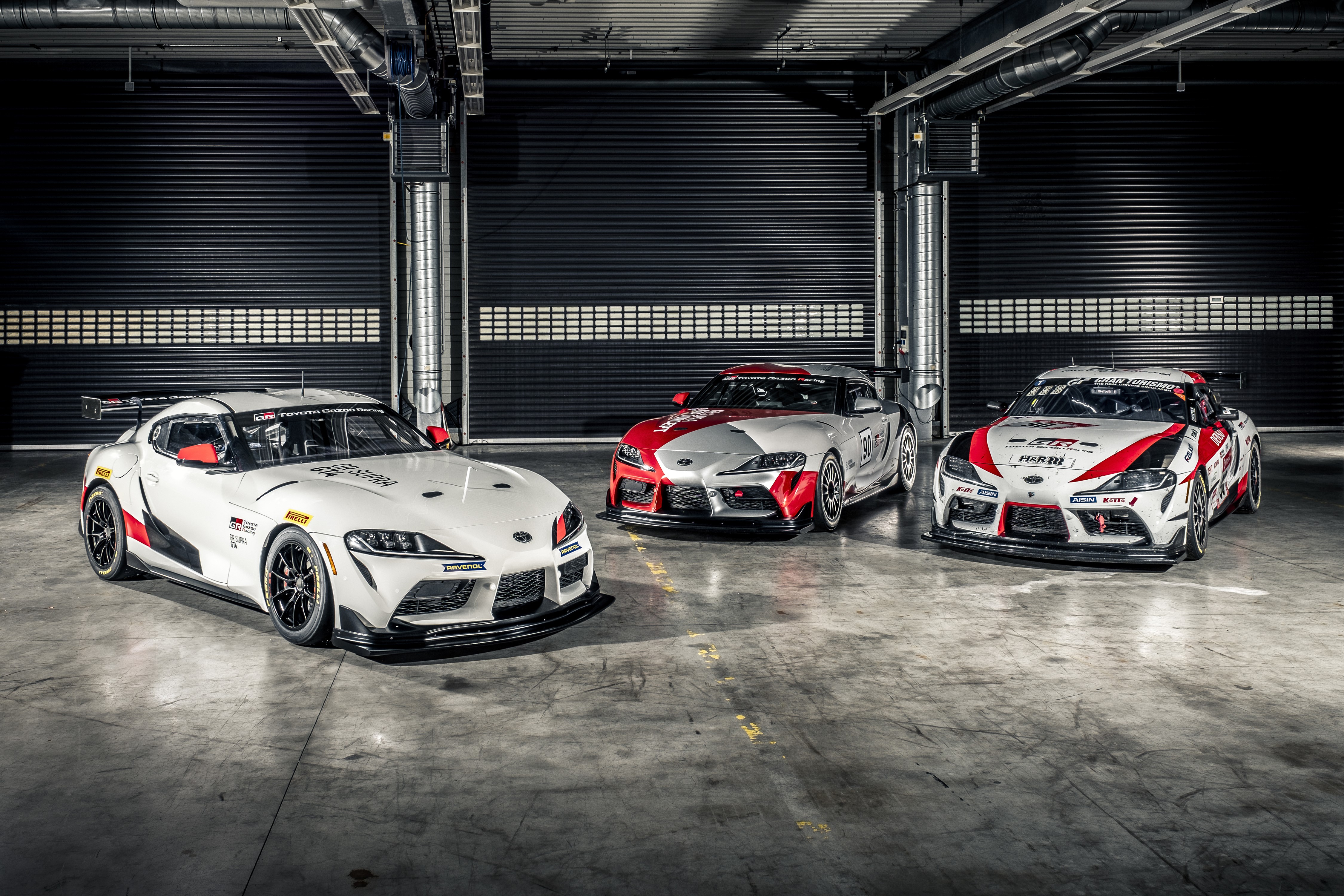 Three Toyota GR Supra GT4 race cars HD Wallpaper