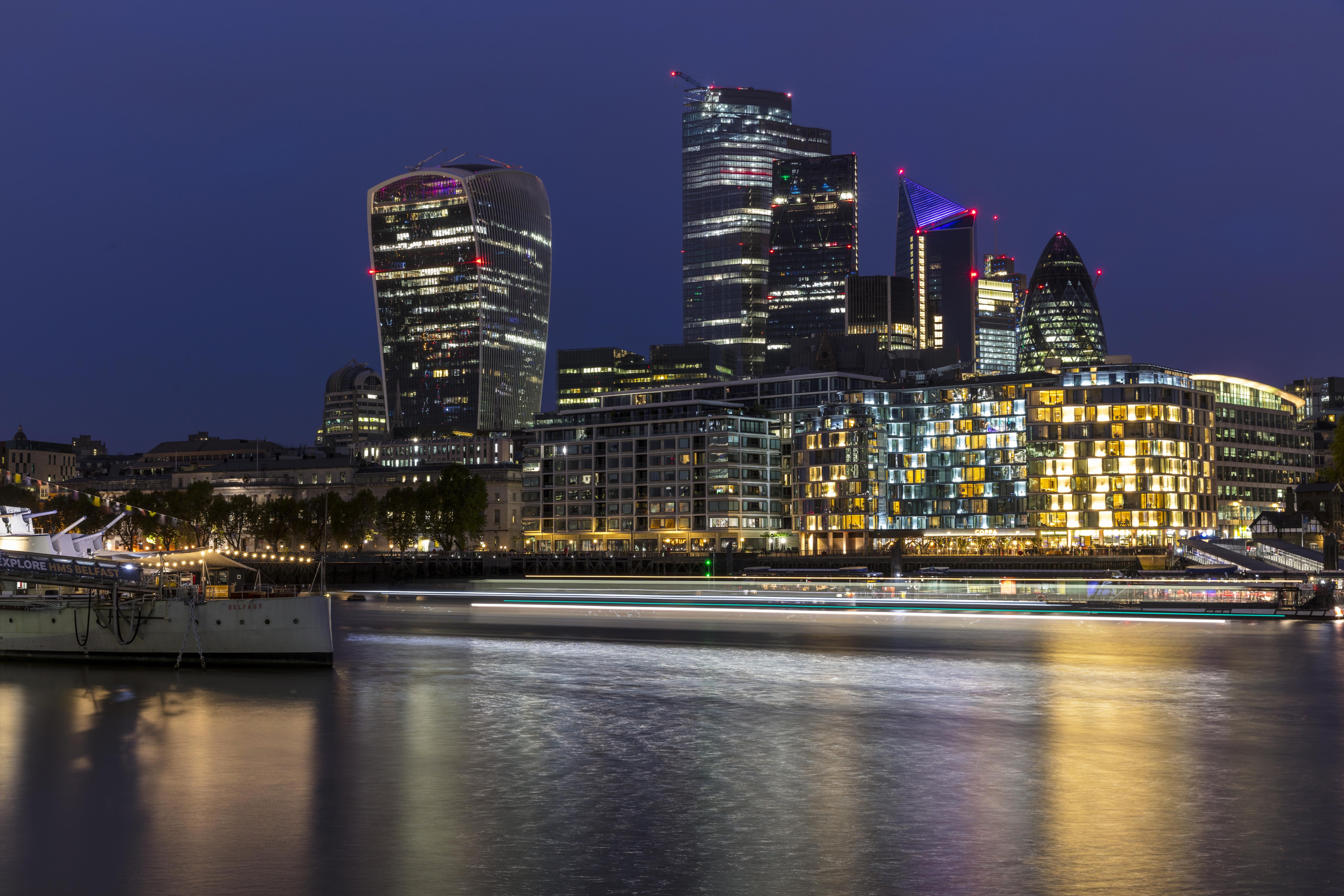 London skyline at dusk with river and boat HD Wallpaper