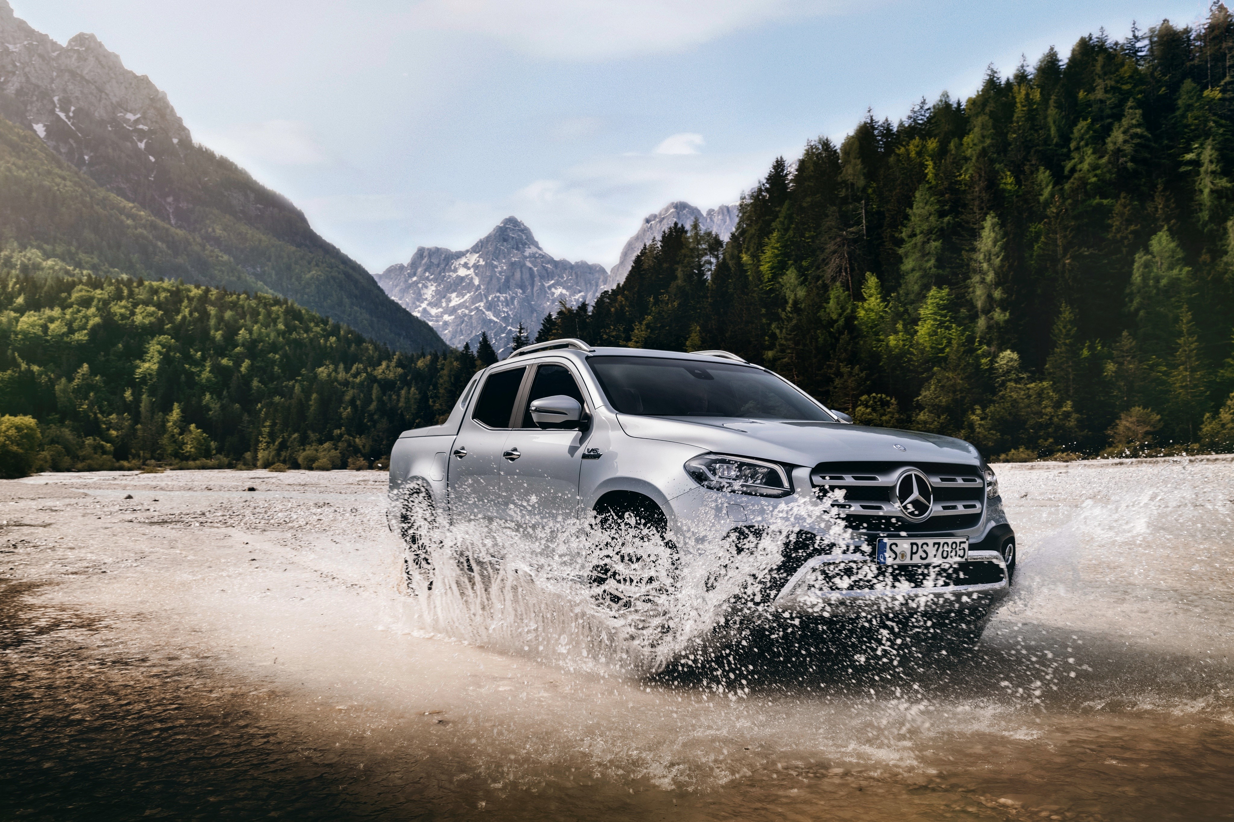 Mercedes-Benz X-Class driving through water splash HD Wallpaper
