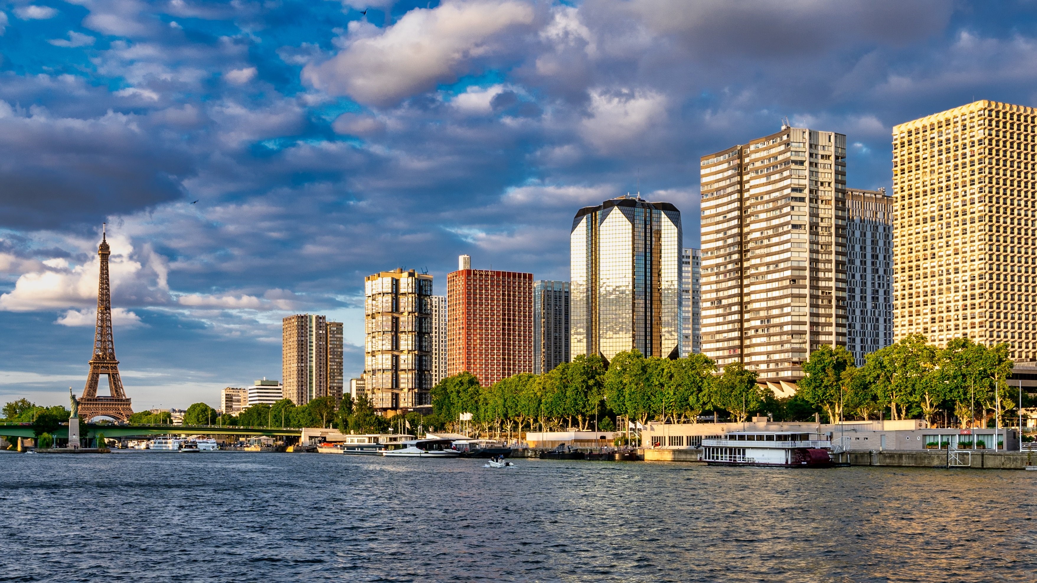 Eiffel Tower and Paris skyline across the Seine River HD Wallpaper