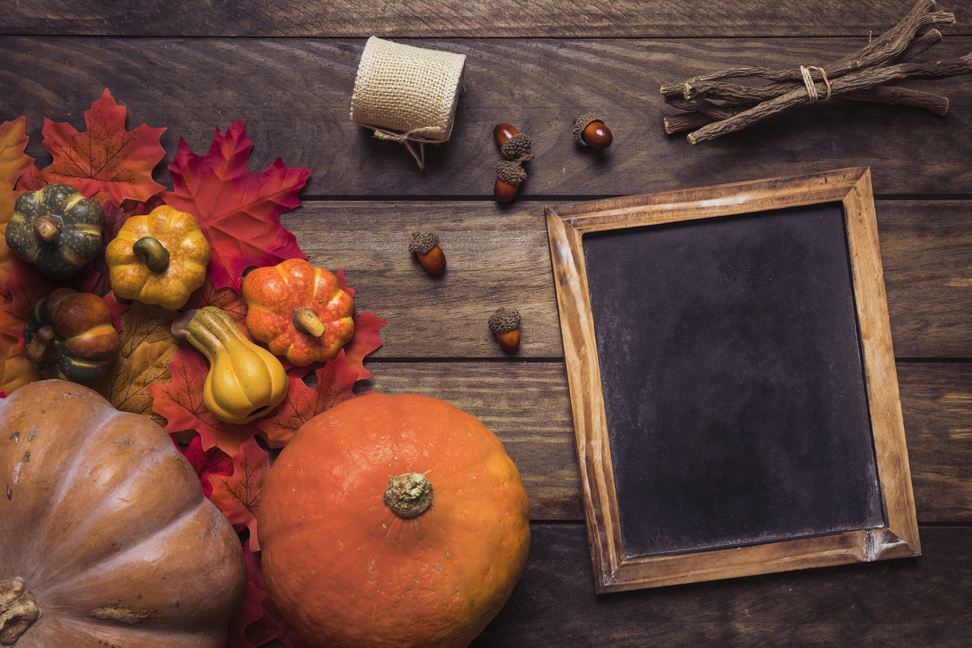Autumn pumpkins and leaves on wood planks with chalkboard HD Wallpaper