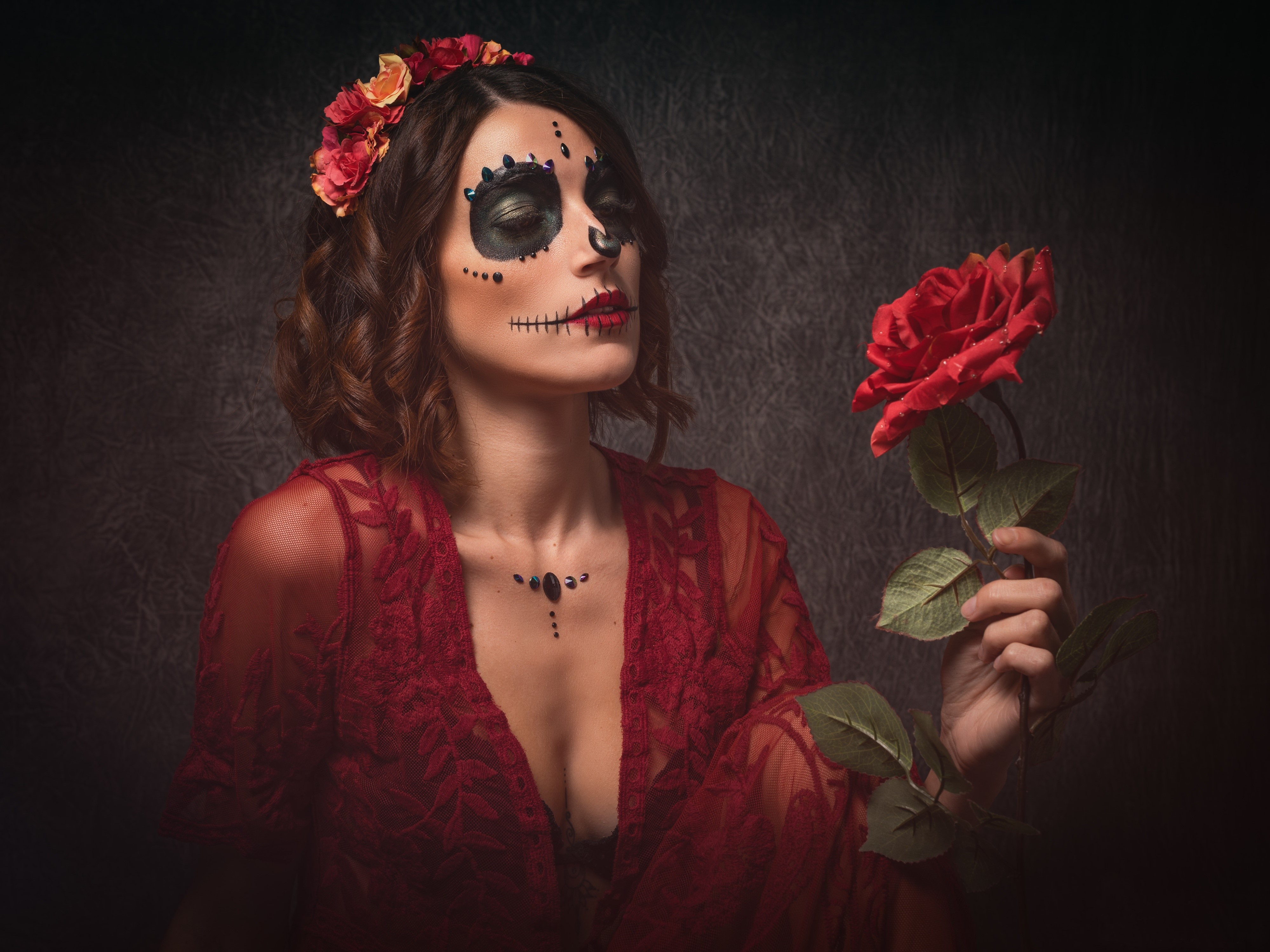 Woman with Day of the Dead makeup holding a rose HD Wallpaper