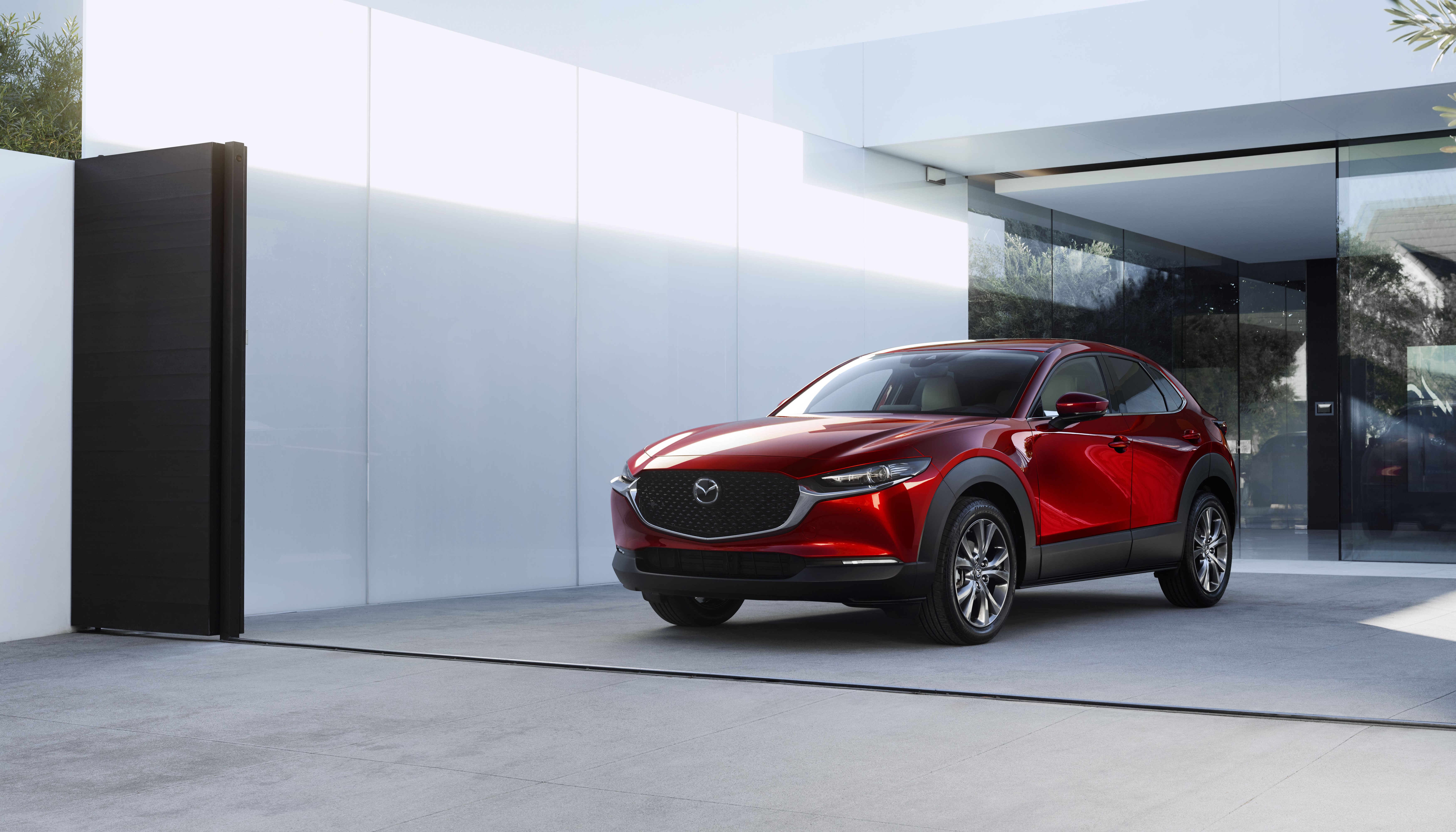 Red Mazda CX-30 Crossover in Modern Driveway HD Wallpaper