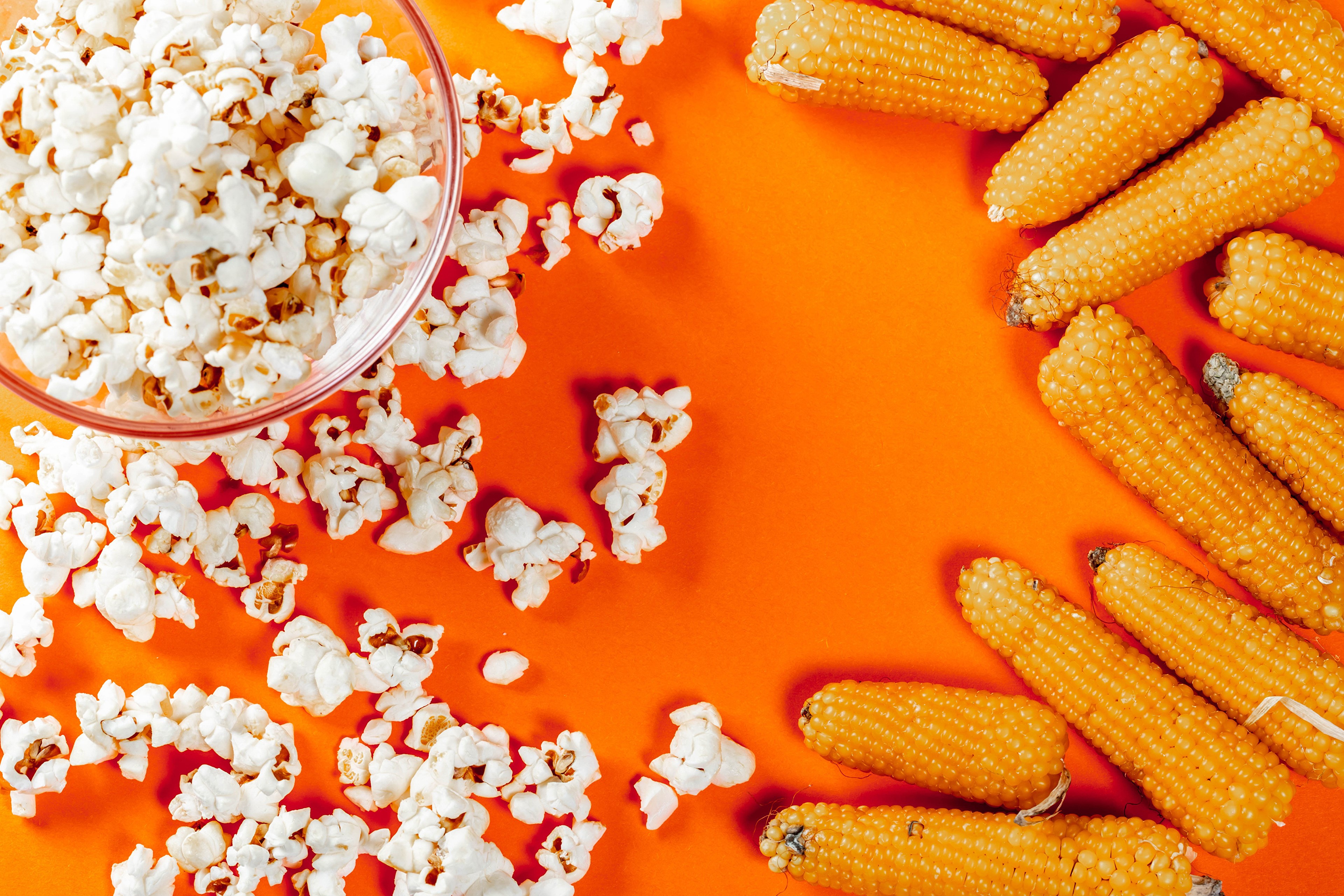 Popcorn and Corn on Orange Background HD Wallpaper