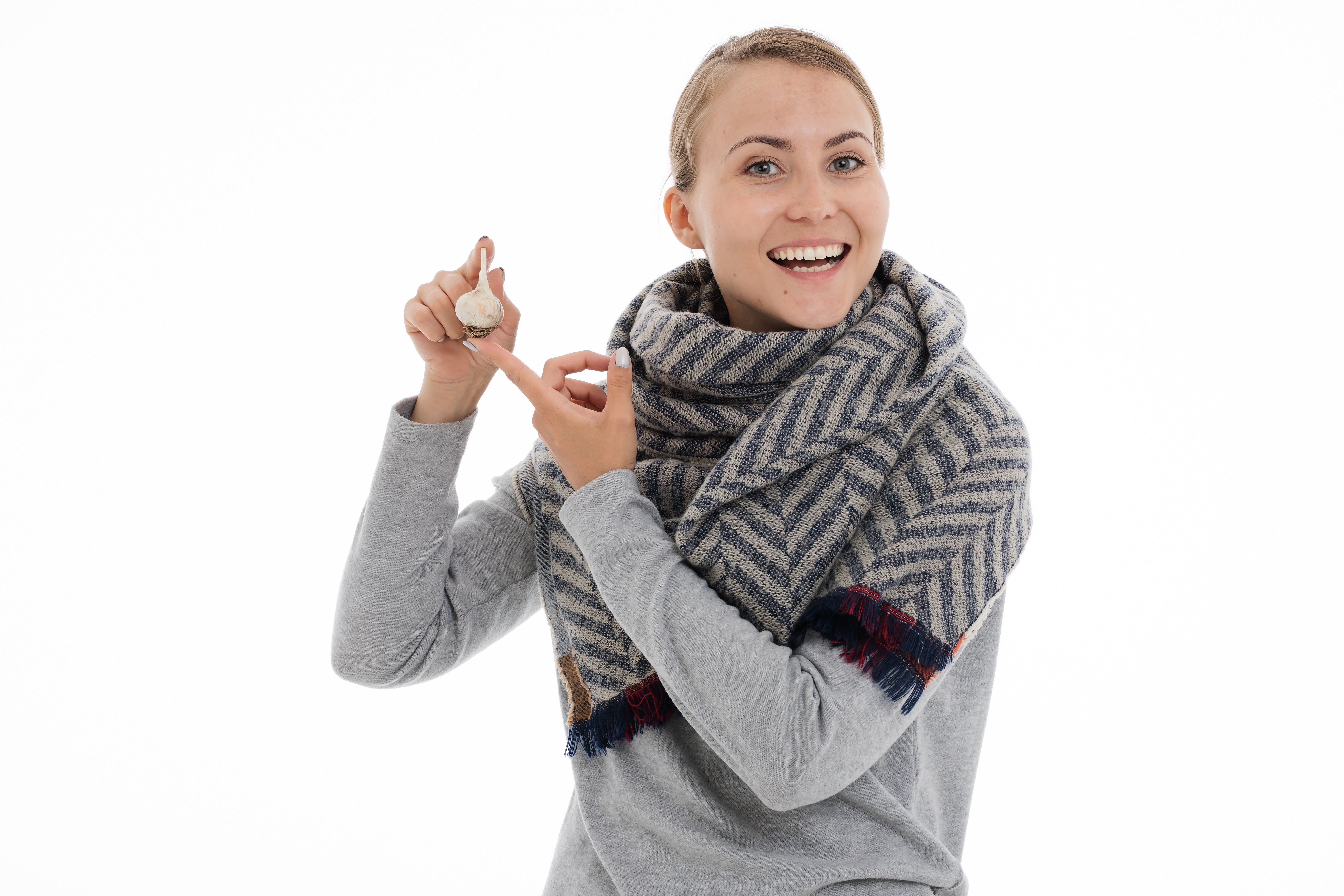 Woman holding garlic on white background HD Wallpaper