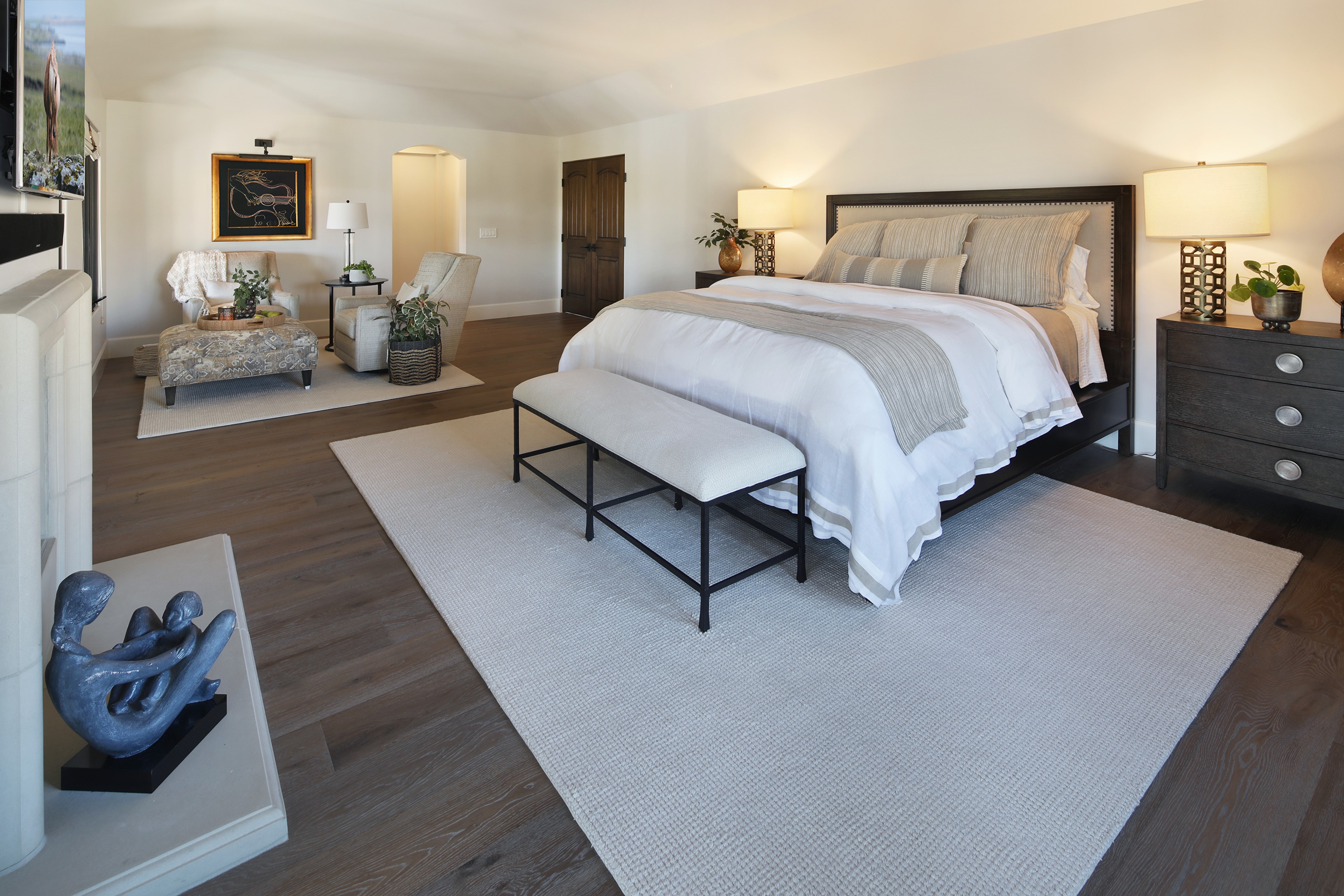 Bedroom with bed, seating area, and fireplace HD Wallpaper