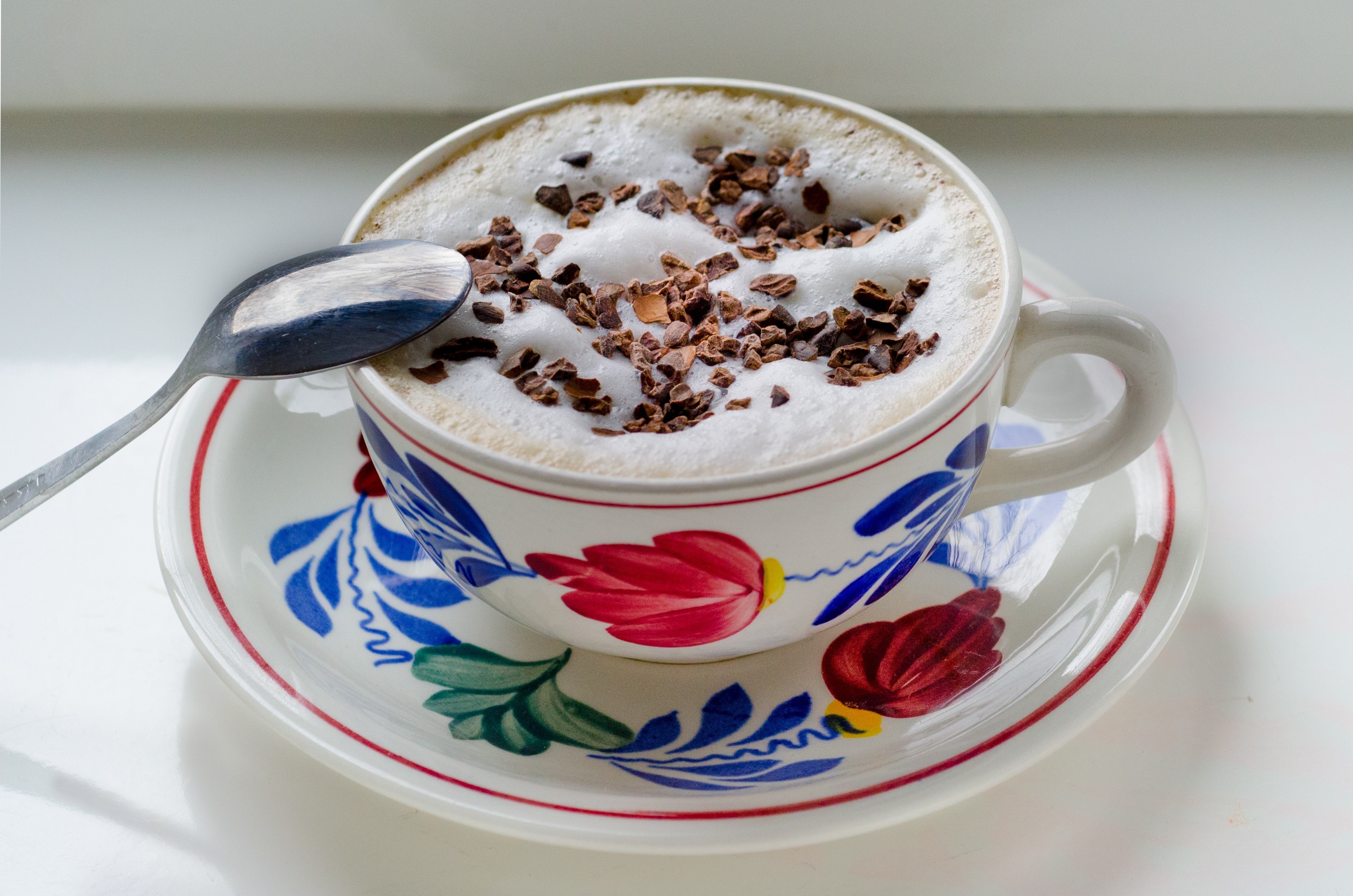 Cappuccino with chocolate shavings and spoon HD Wallpaper