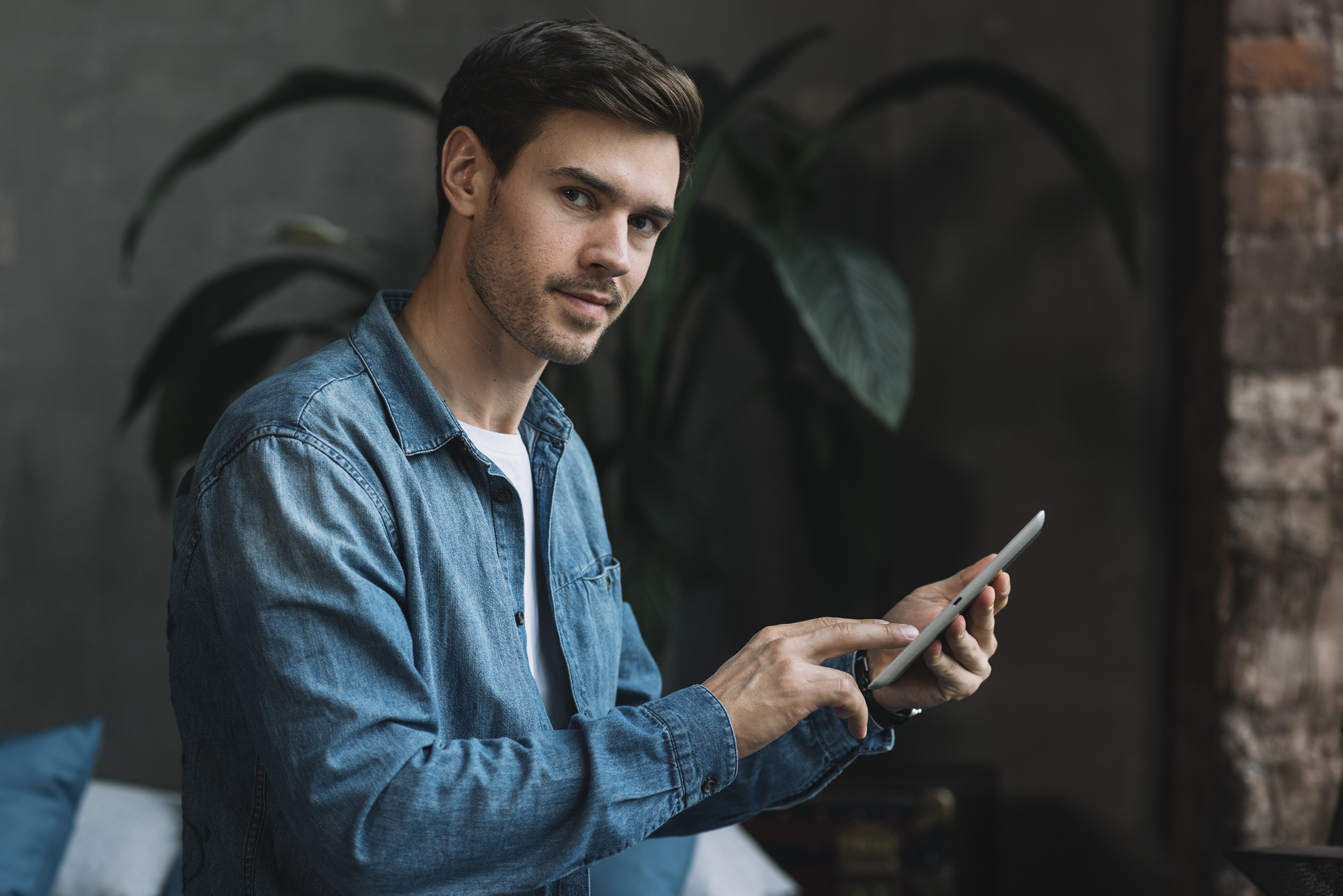 Man in Denim Shirt Holding Tablet HD Wallpaper