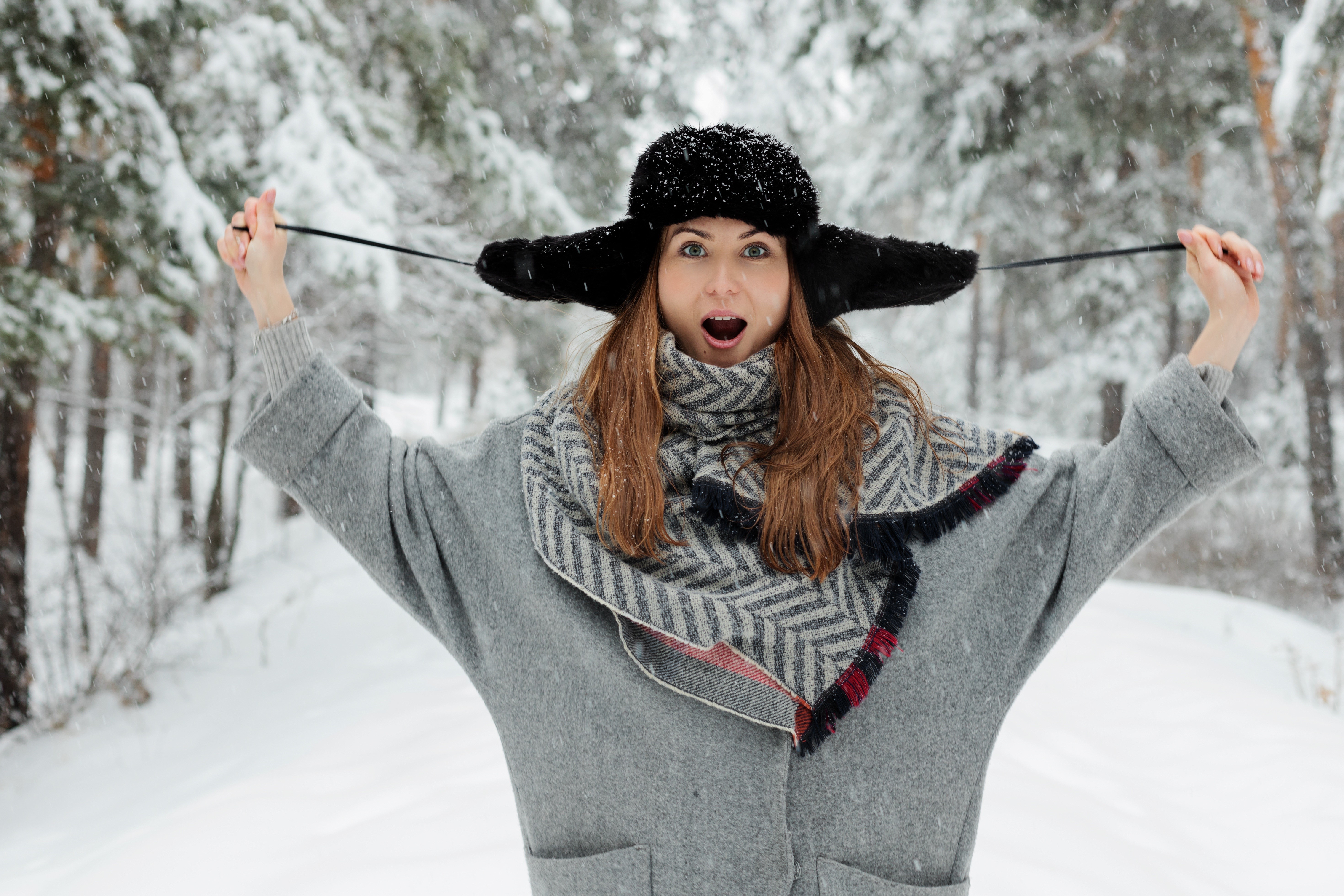 Woman in winter hat and coat in snow HD Wallpaper