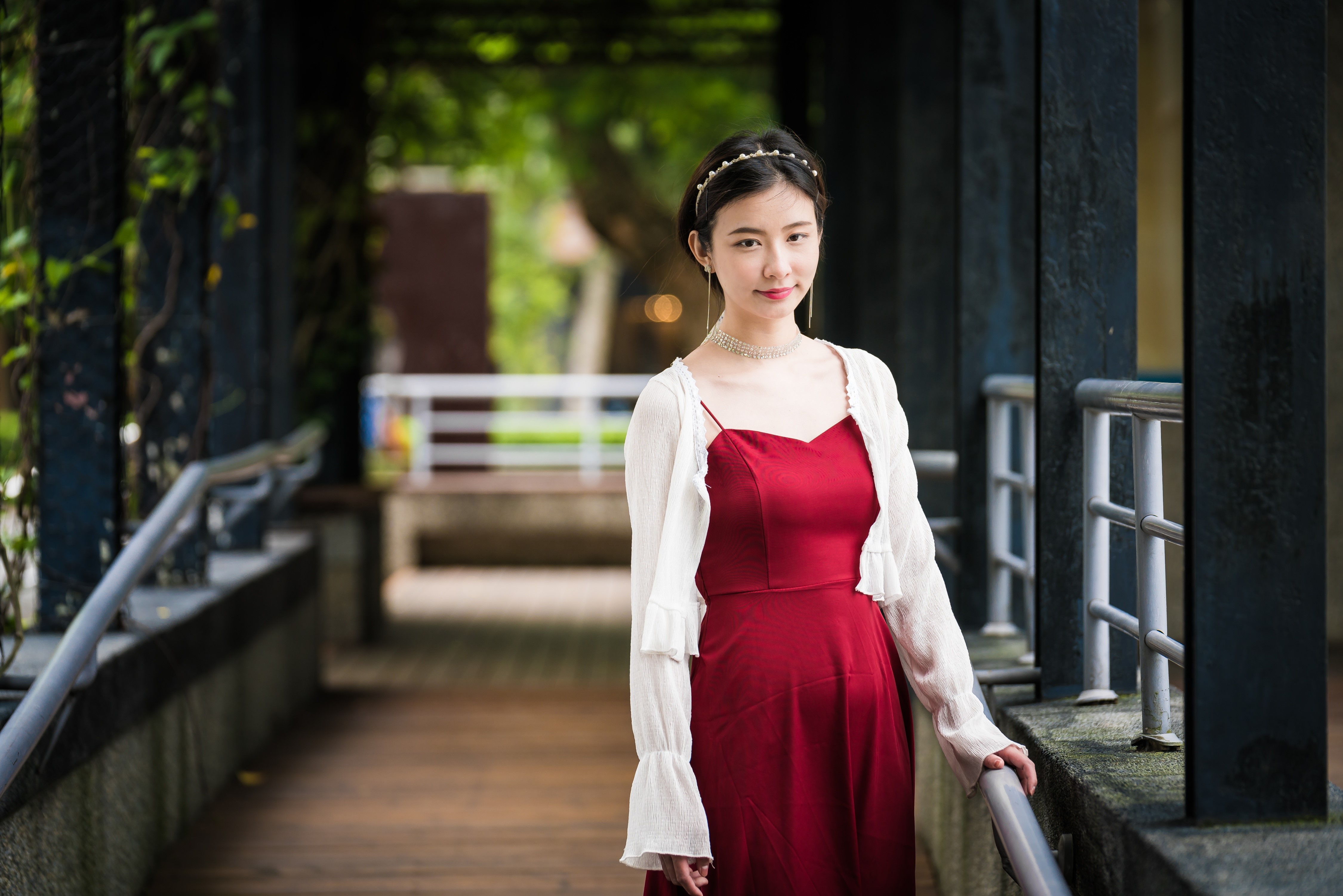 Asian girl in red dress on a walkway HD Wallpaper