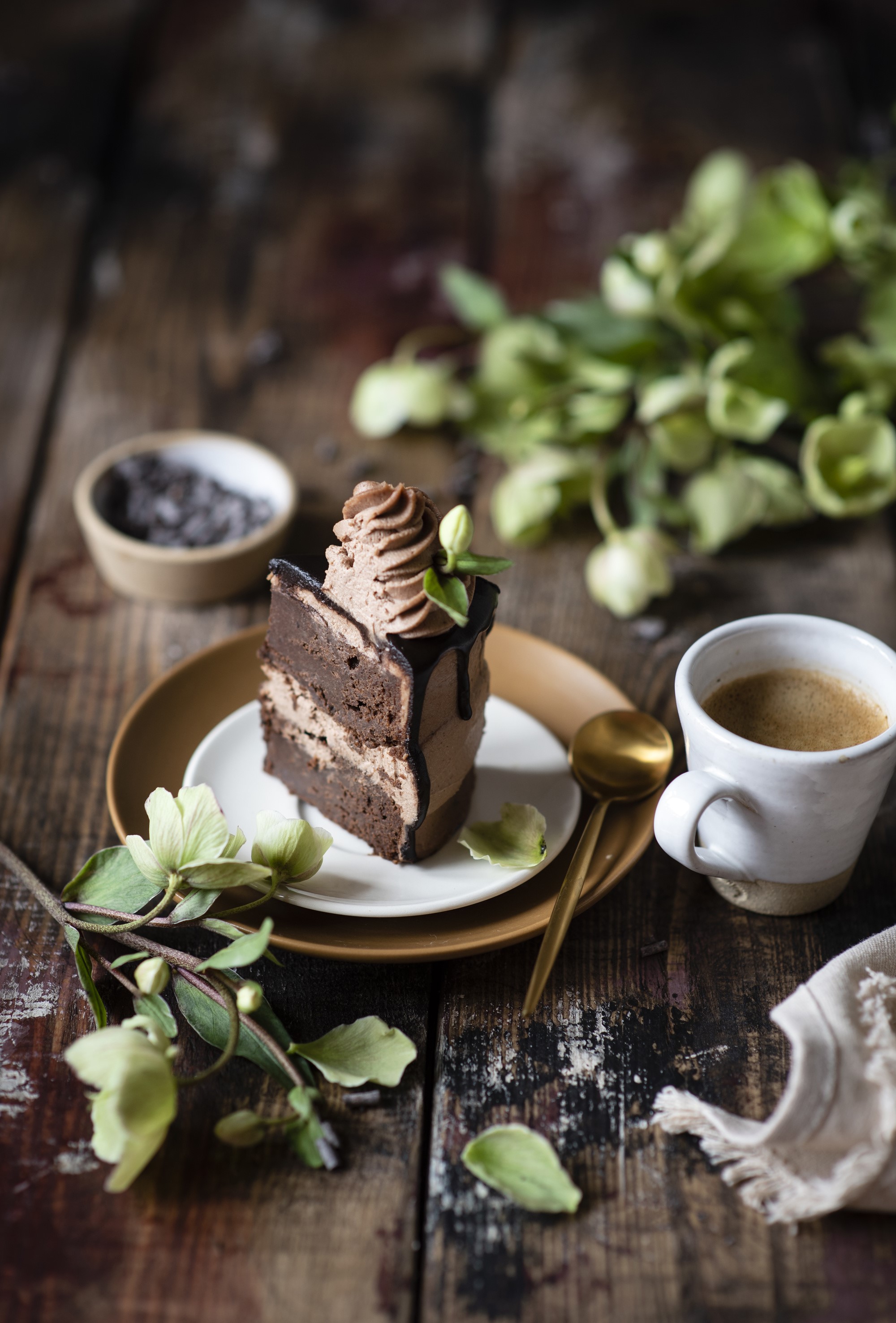 Chocolate cake slice with coffee and hellebore flowers HD Phone Wallpaper