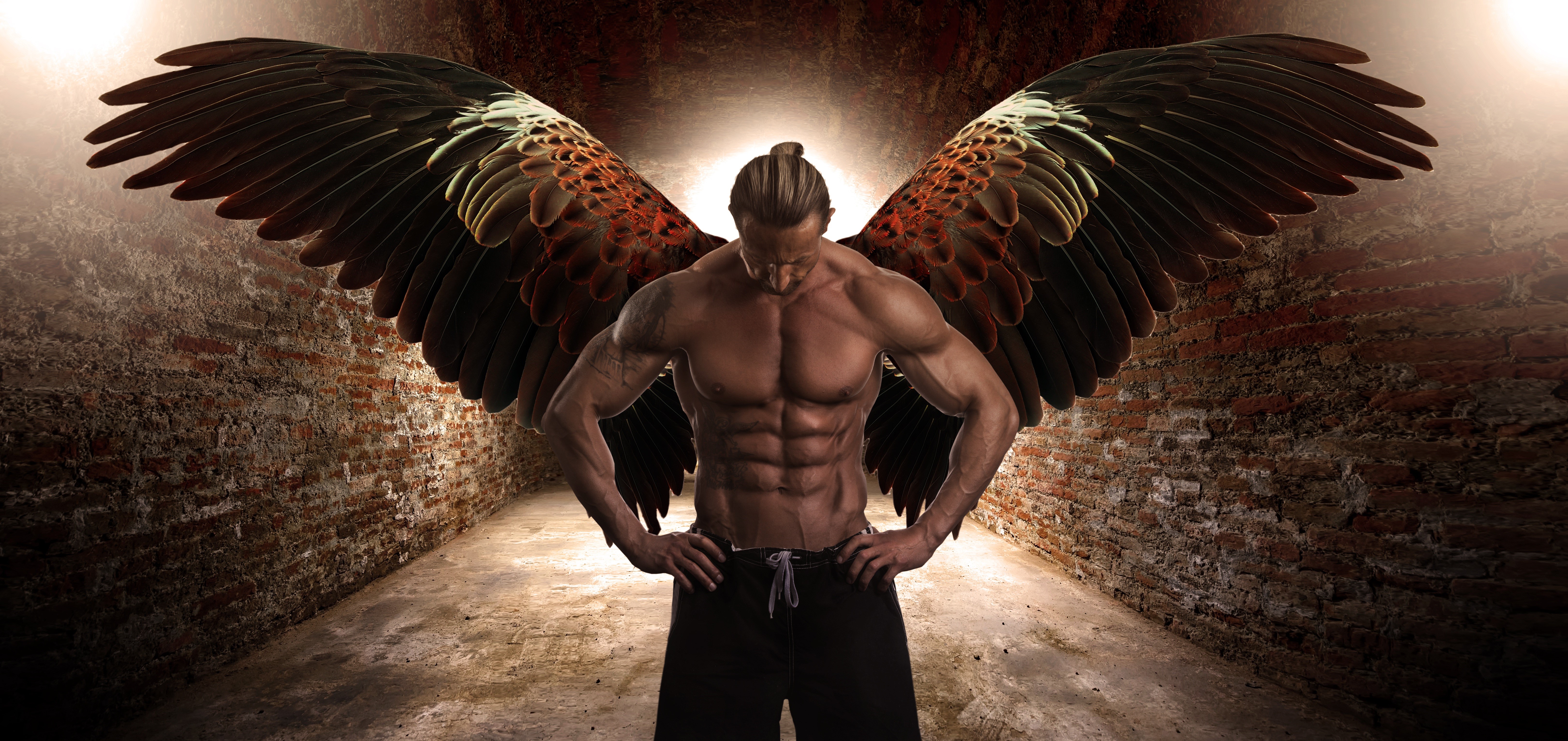 Man with muscular physique and large wings HD Wallpaper