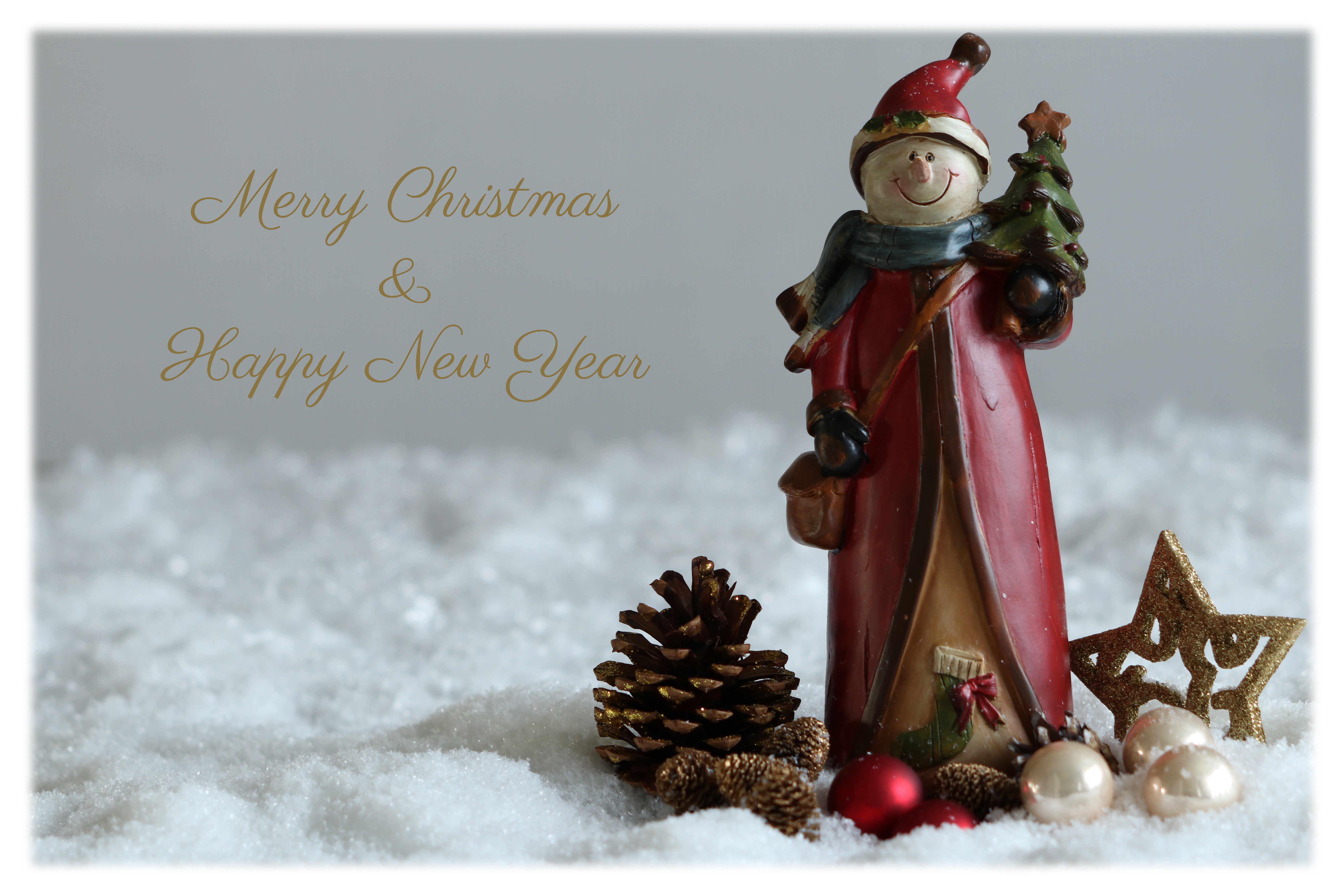 Christmas and New Year greeting with snowman figurine HD Wallpaper